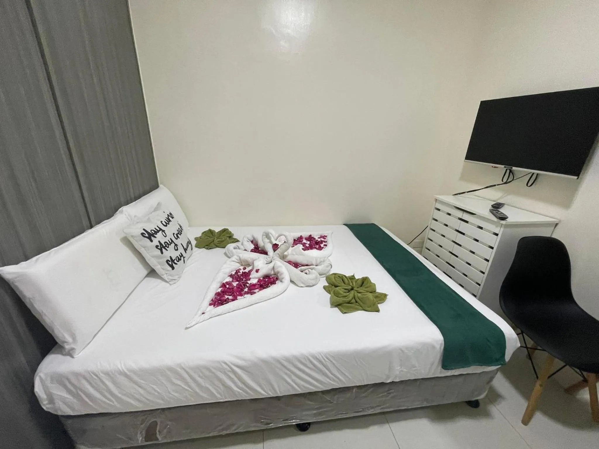 Bed in Green Residences Stays by PBYY