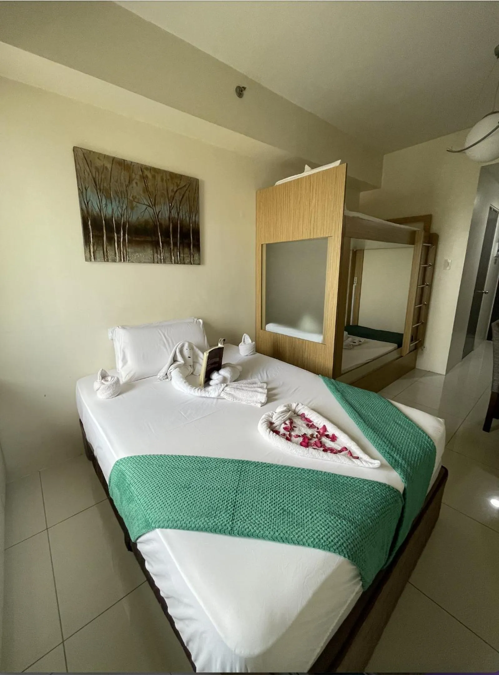 Bed in Green Residences Stays by PBYY