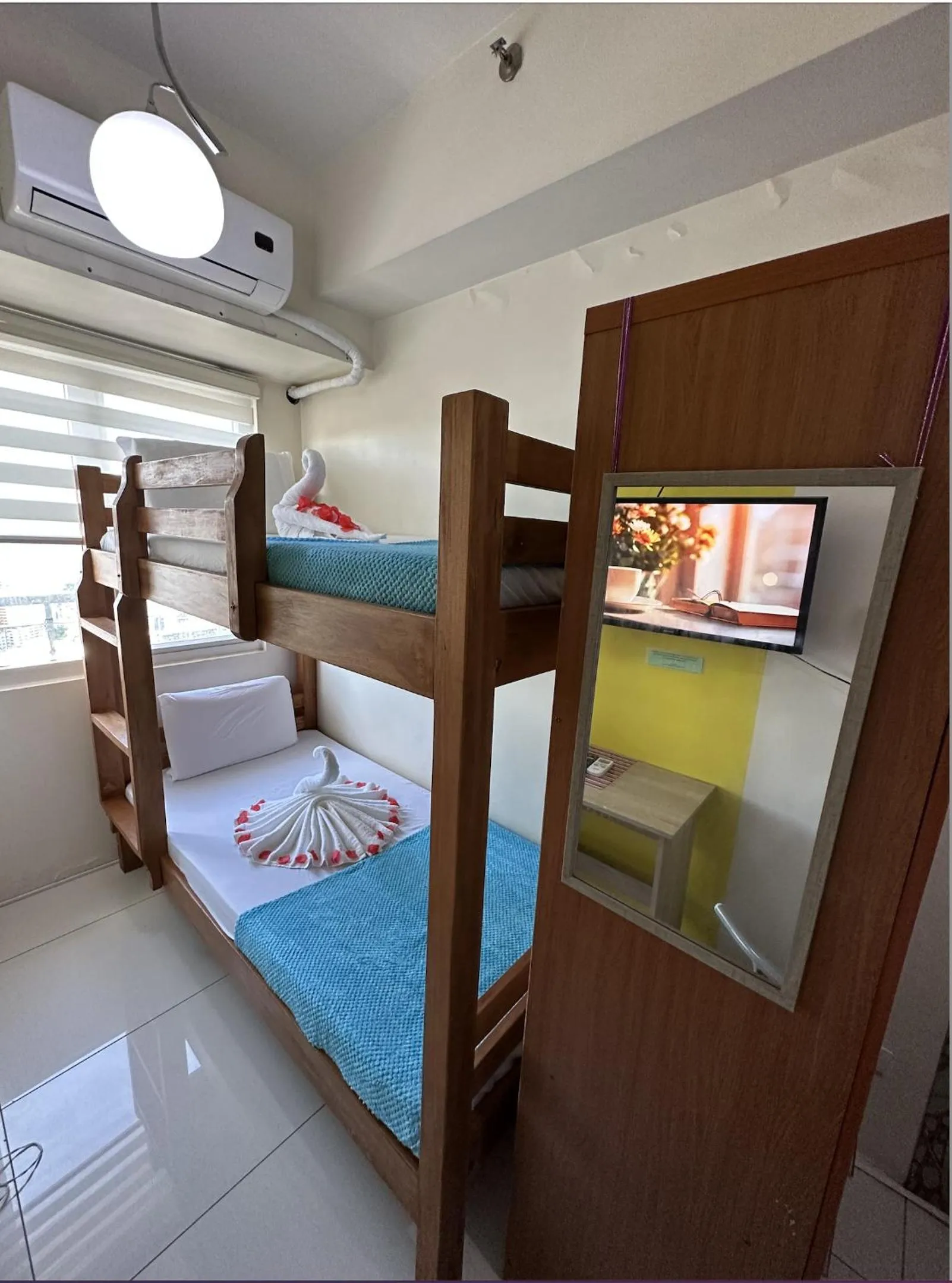 Bed in Green Residences Stays by PBYY