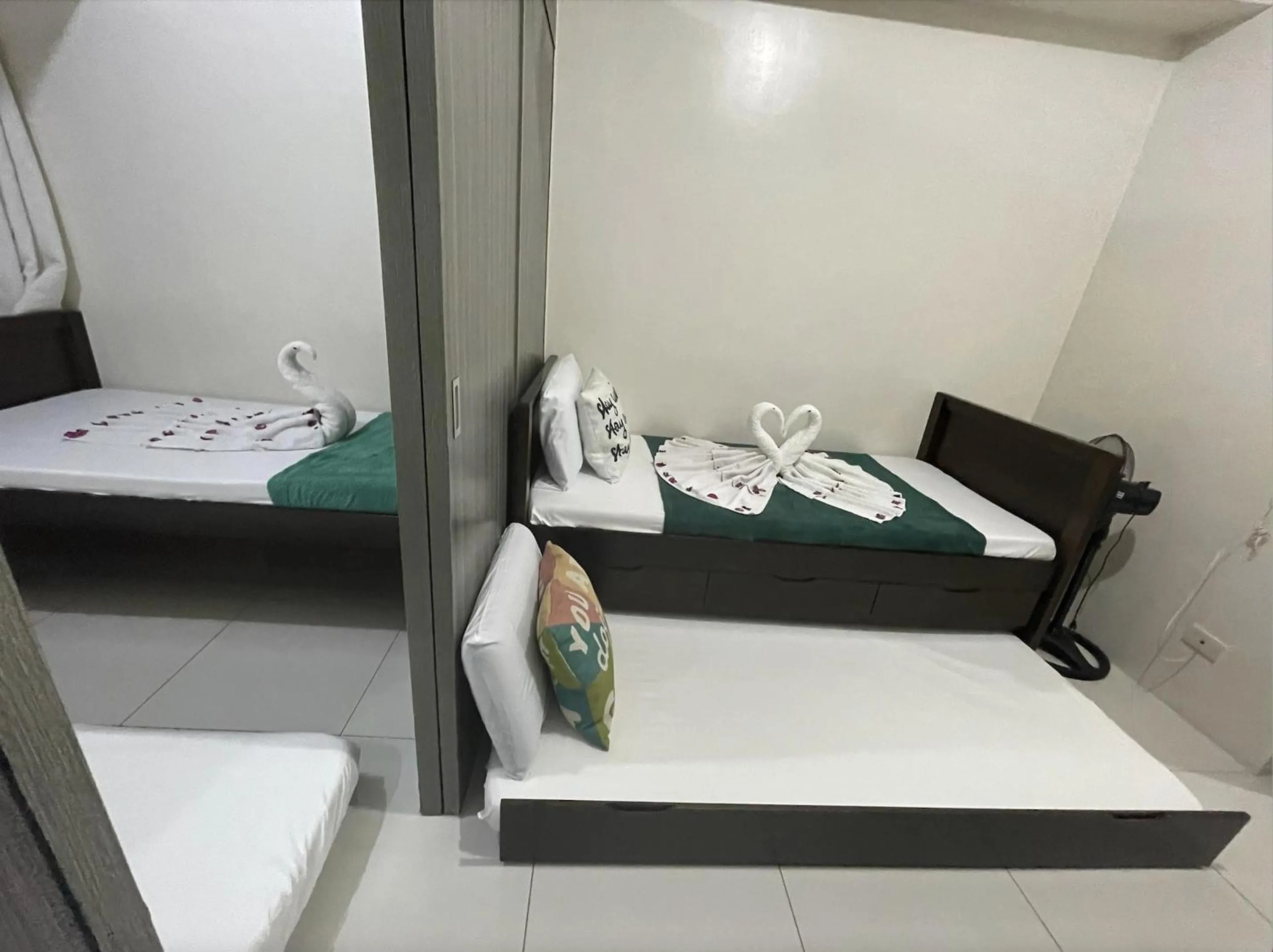 Bed in Green Residences Stays by PBYY
