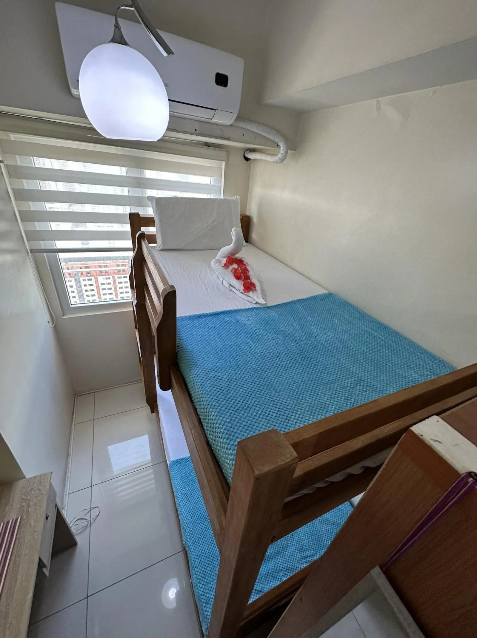 Bed in Green Residences Stays by PBYY