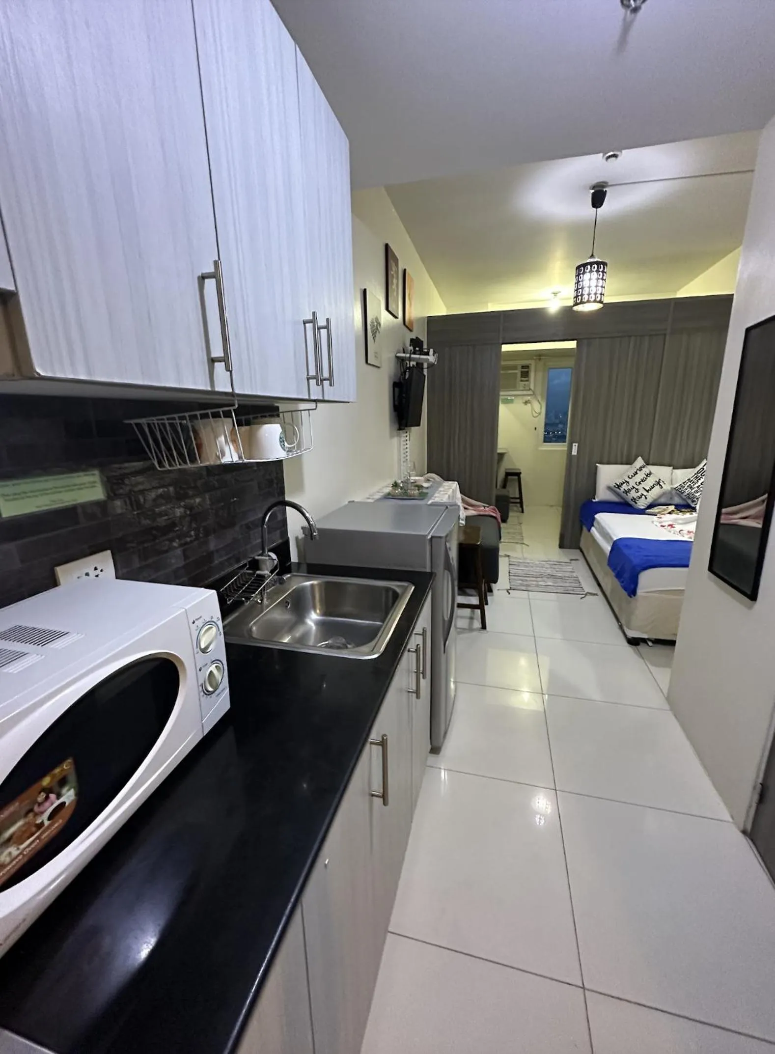 Bed in Green Residences Stays by PBYY