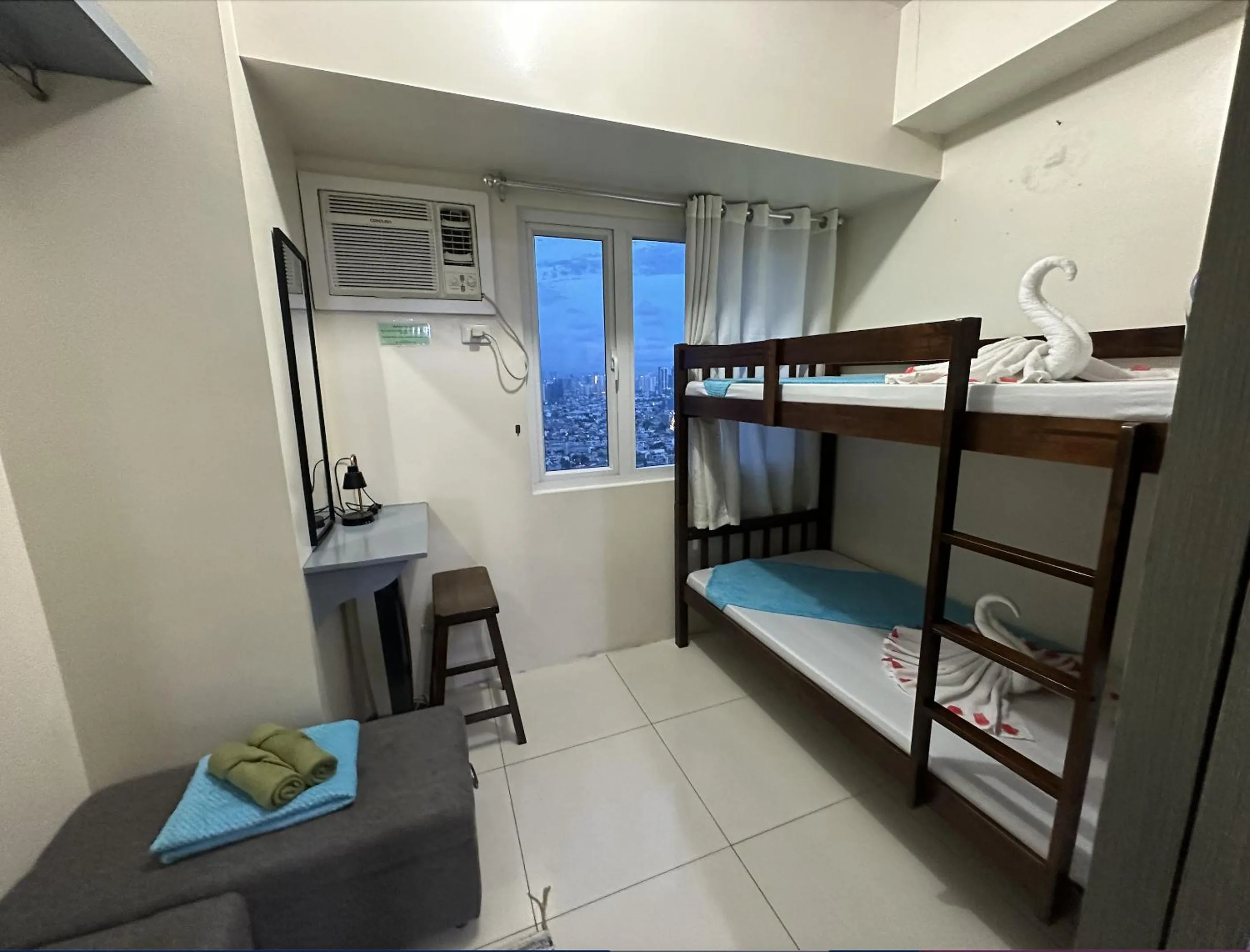 Bed in Green Residences Stays by PBYY