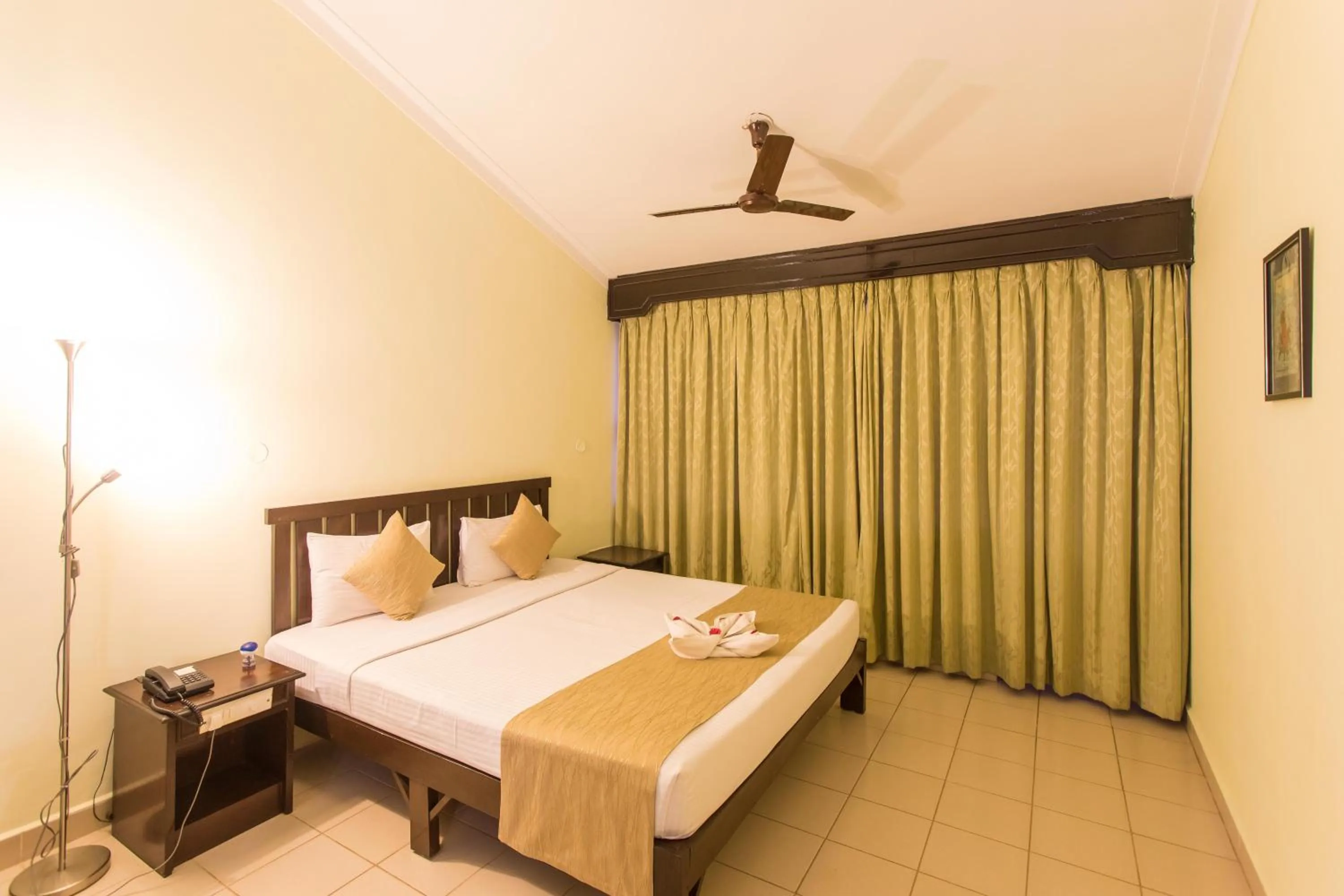 Bed in Hotel Coorg International