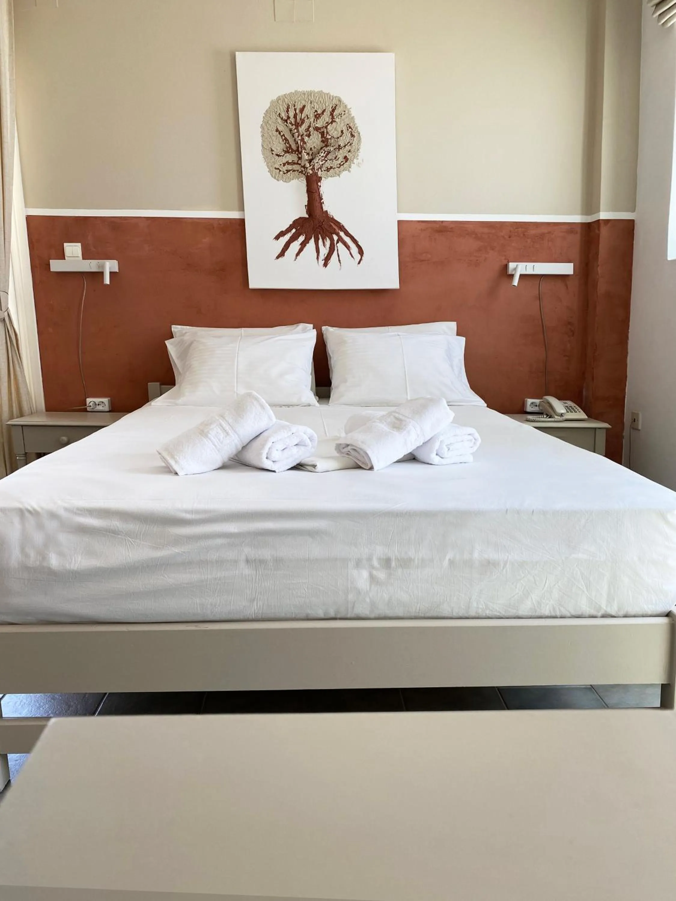 Bed in Agnadi Syros Beachfront Studios & Rooms