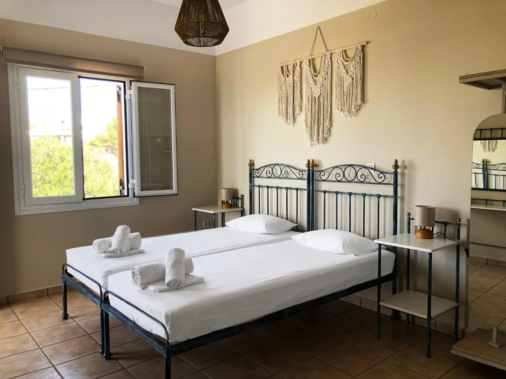 Bed in Agnadi Syros Beachfront Studios & Rooms