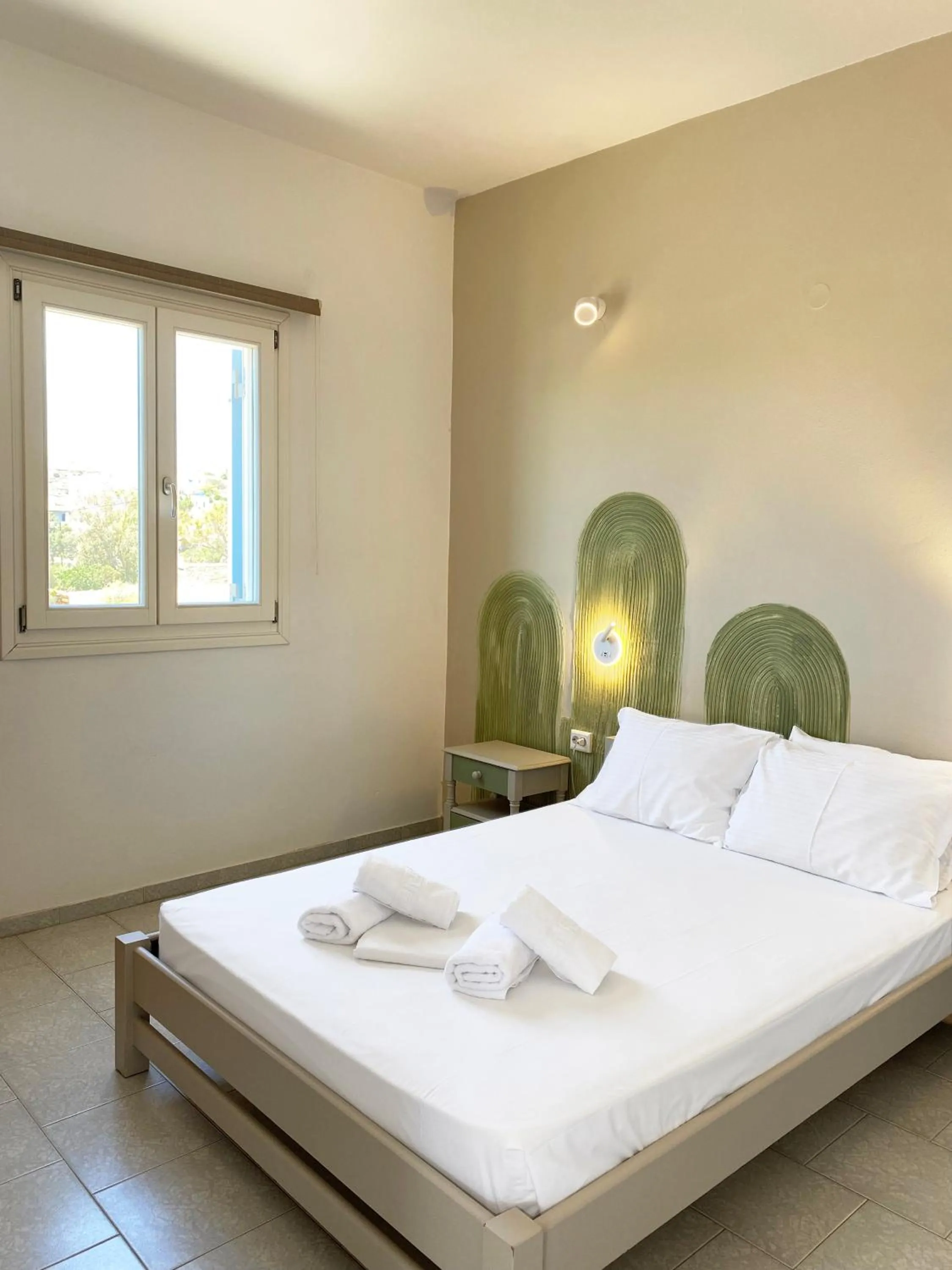 Bed in Agnadi Syros Beachfront Studios & Rooms