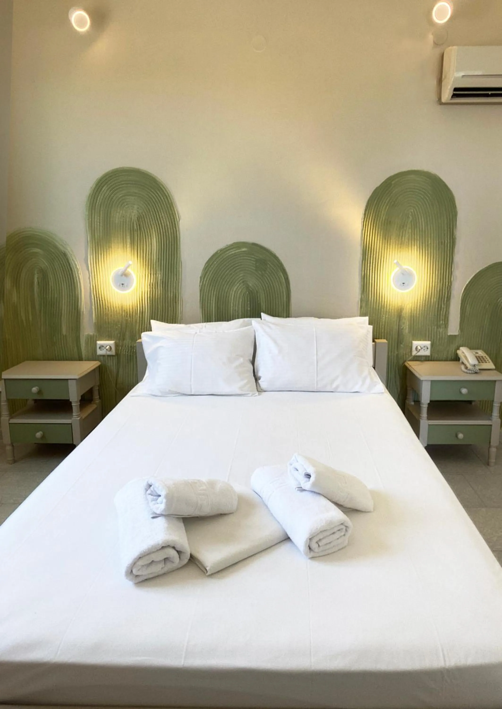 Bed in Agnadi Syros Beachfront Studios & Rooms