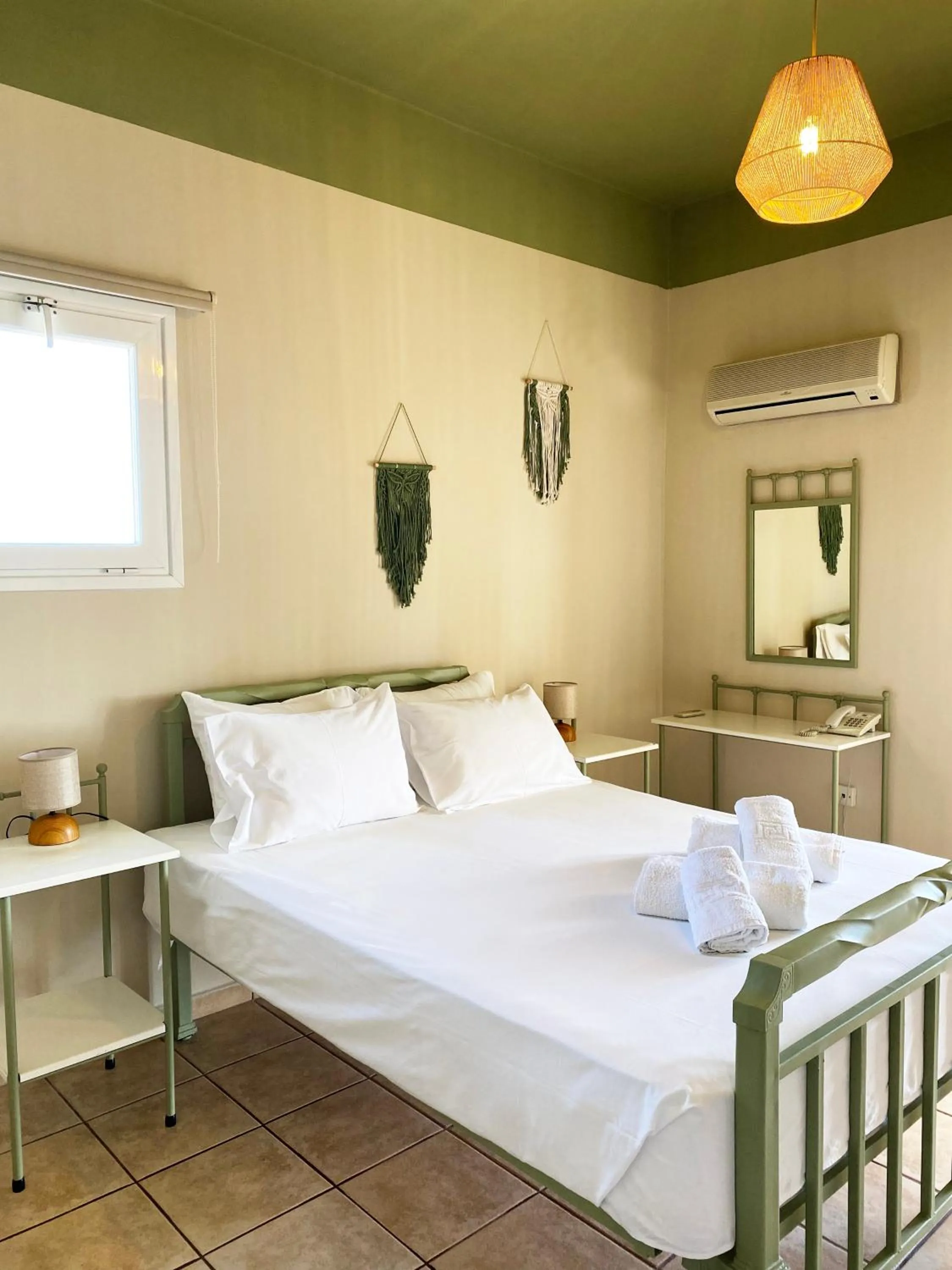 Bed in Agnadi Syros Beachfront Studios & Rooms