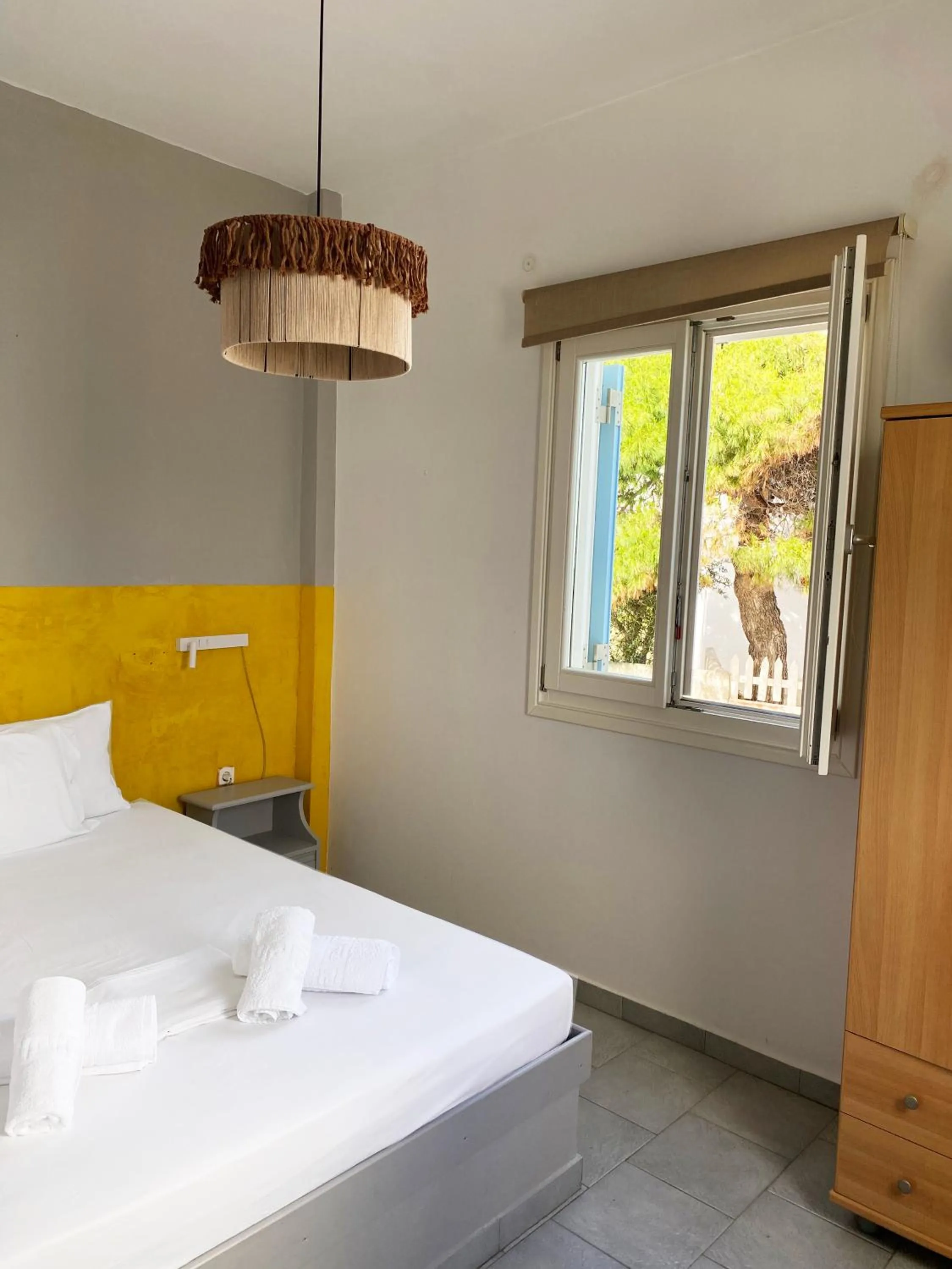 Bed in Agnadi Syros Beachfront Studios & Rooms