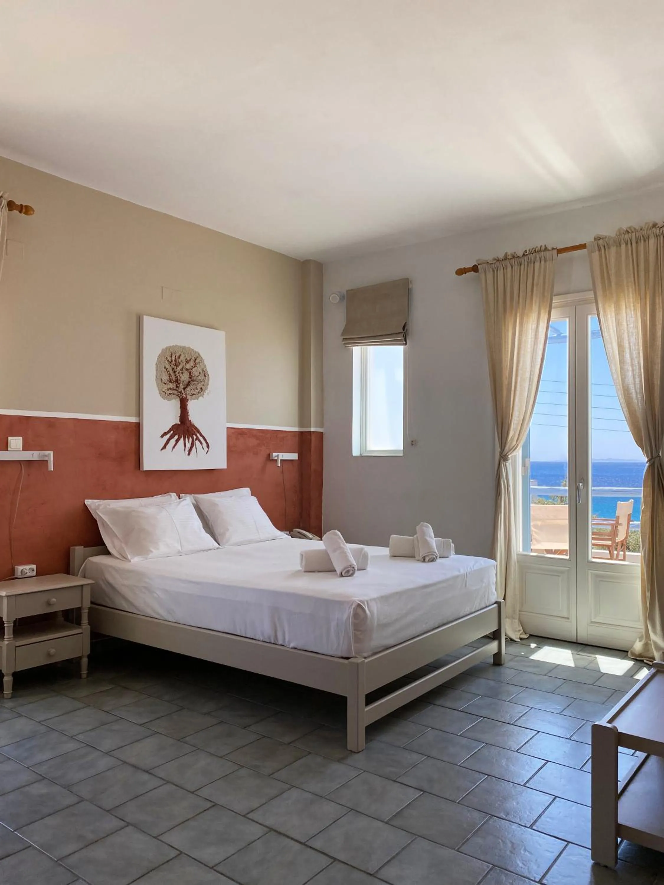 Bed in Agnadi Syros Beachfront Studios & Rooms