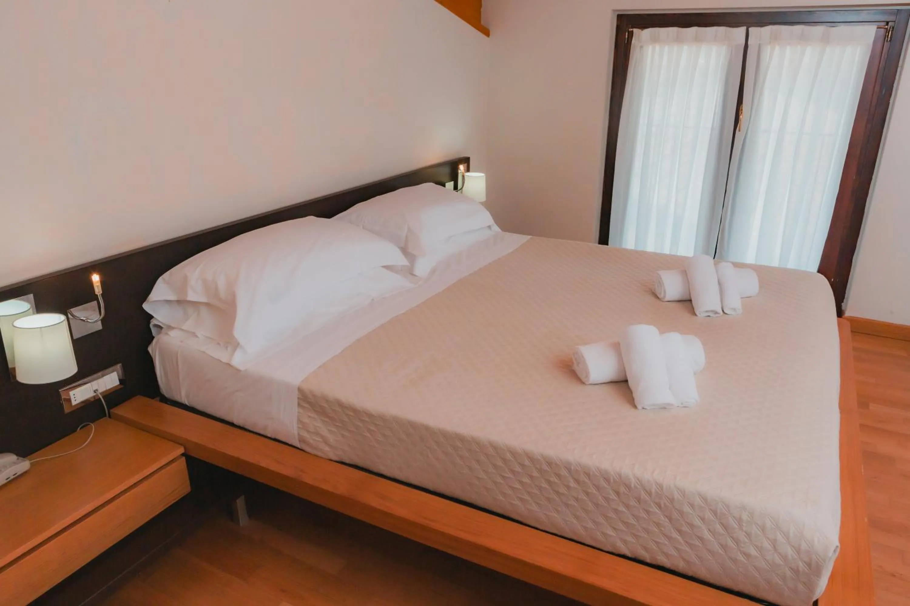 Bed in AHG Donna Silvia Wellness Hotel