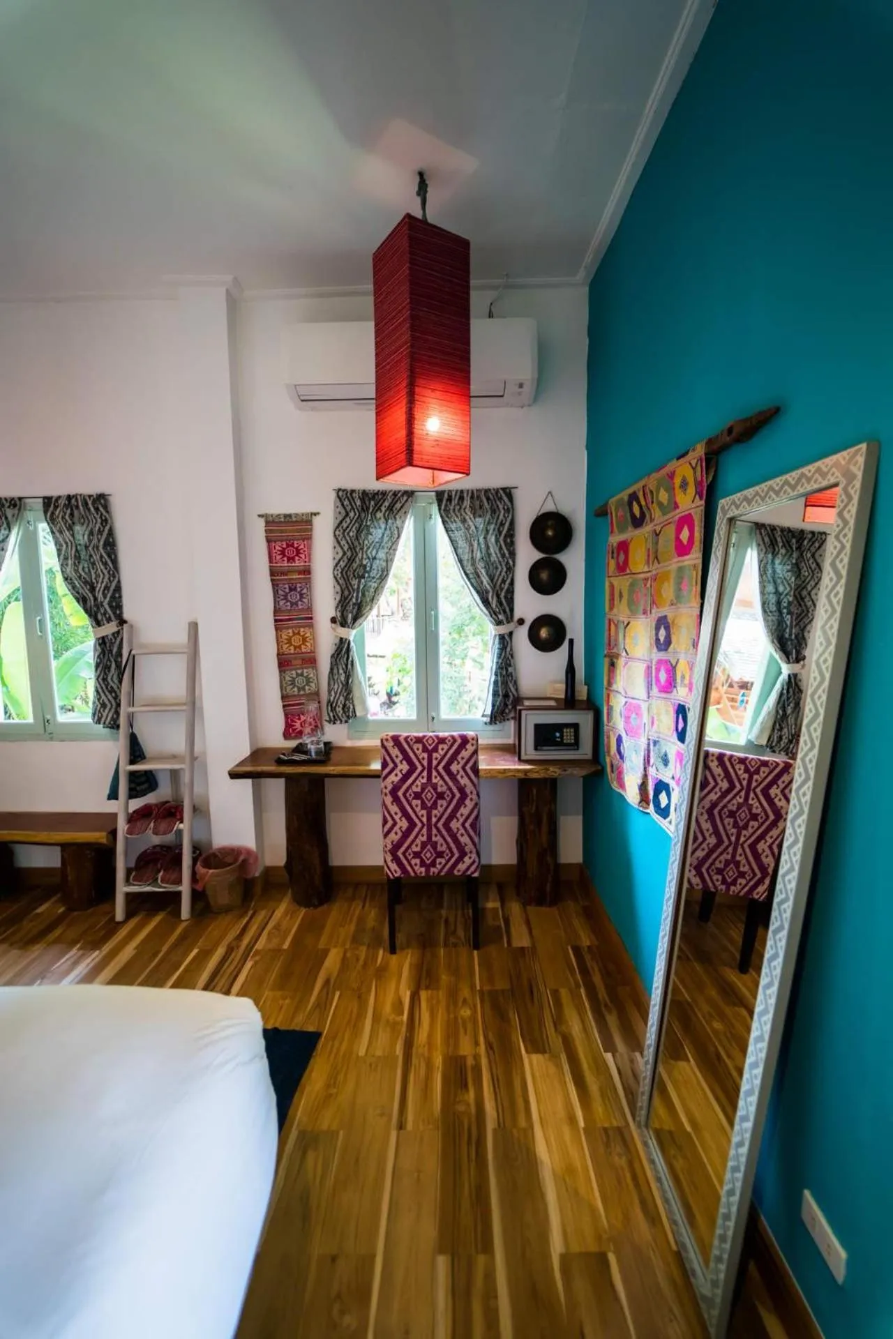 Decorative detail, Bed in Ock Pop Tok Mekong Villa