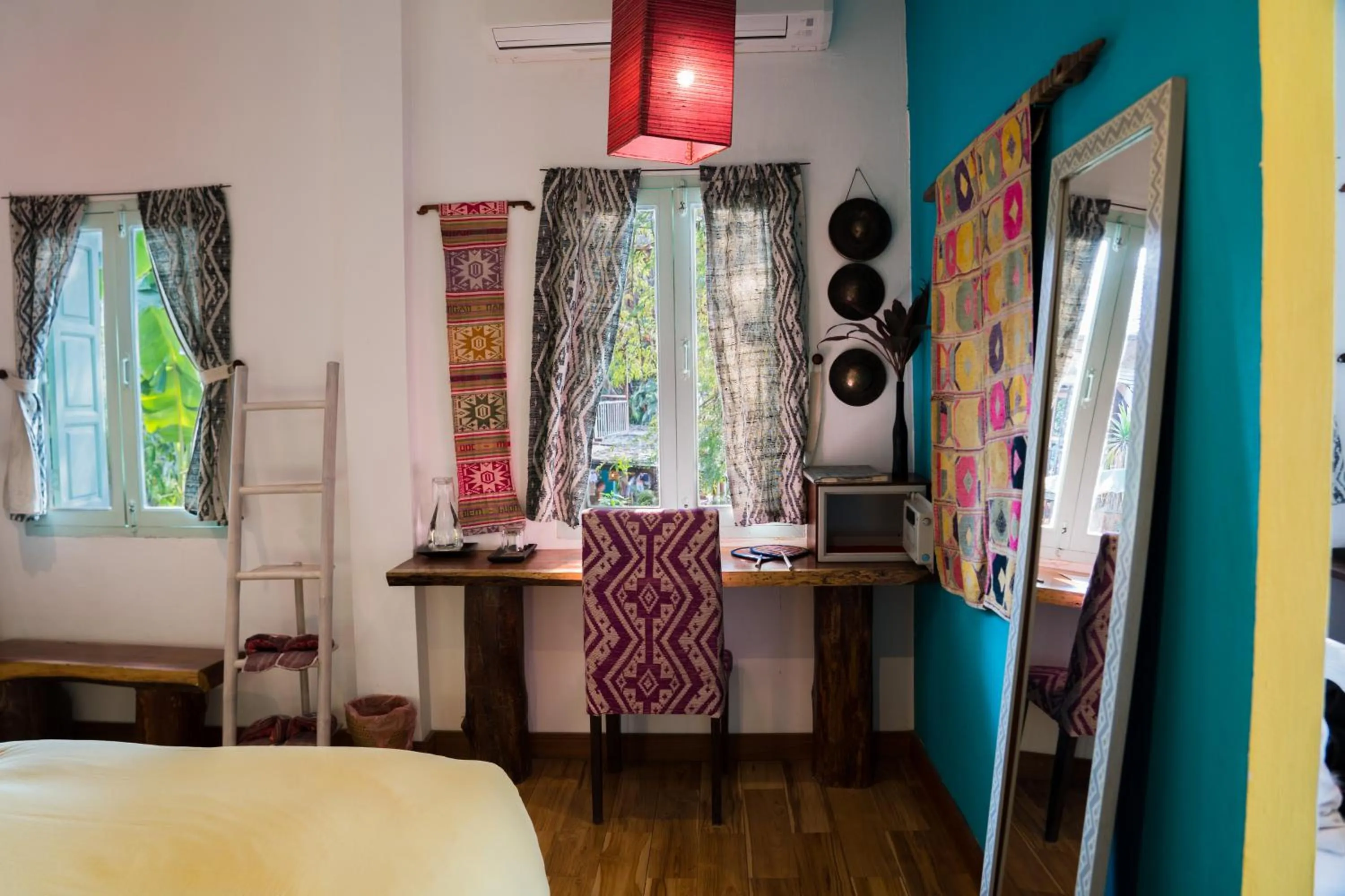 Decorative detail, Bed in Ock Pop Tok Mekong Villa