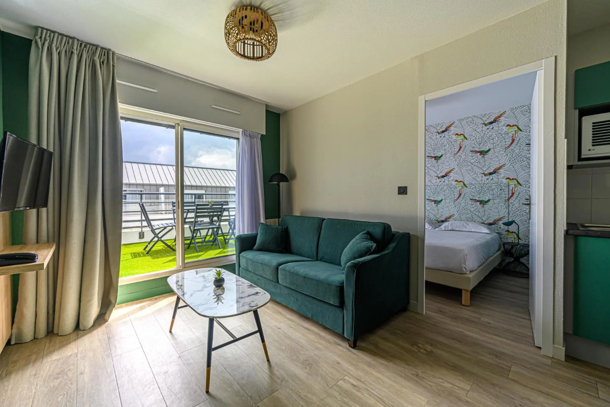 Living room, Bed in Appart Hôtel Le Liberté Vannes Centre-Ville