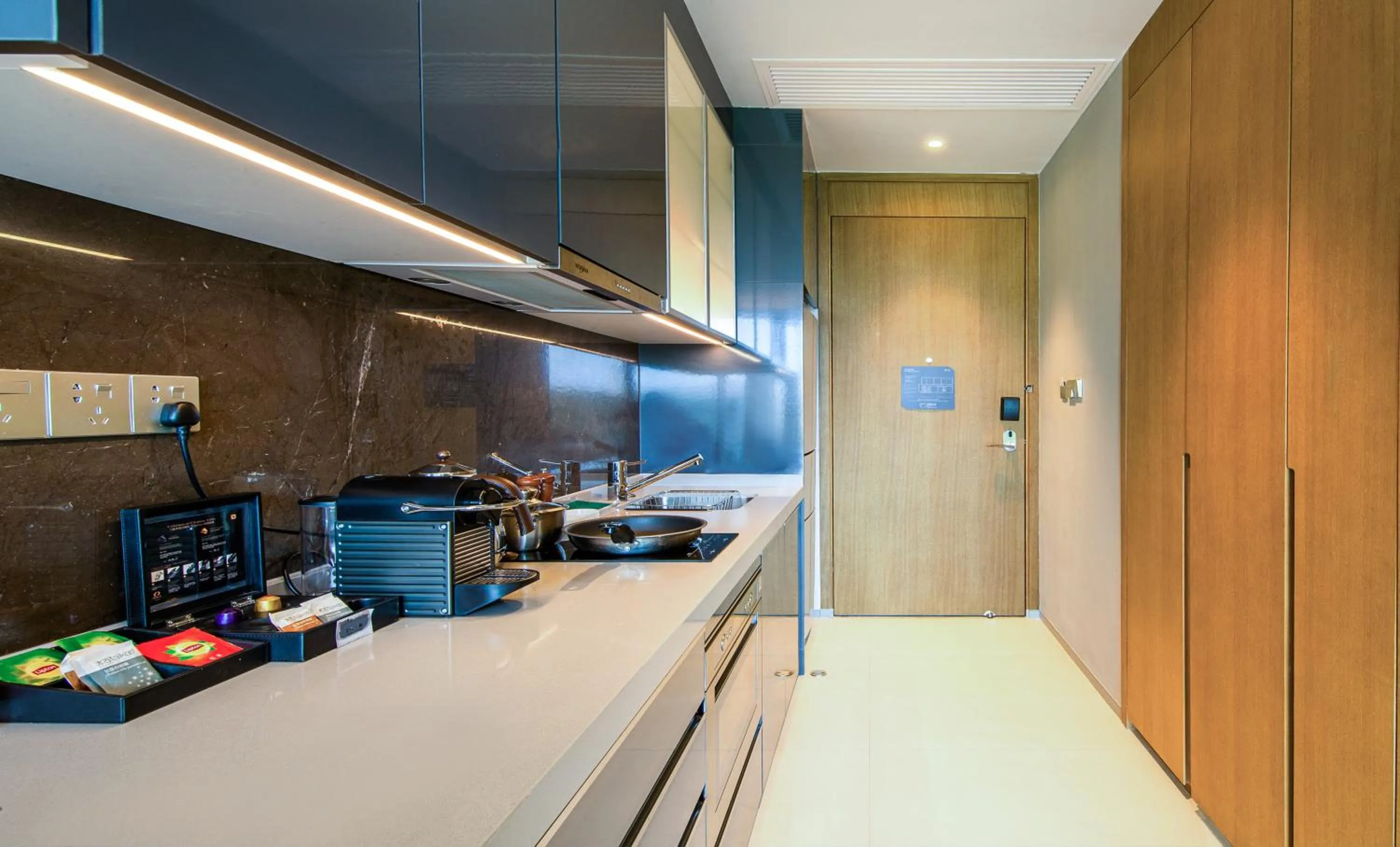 Kitchen or kitchenette in Oakwood Apartments Sanya