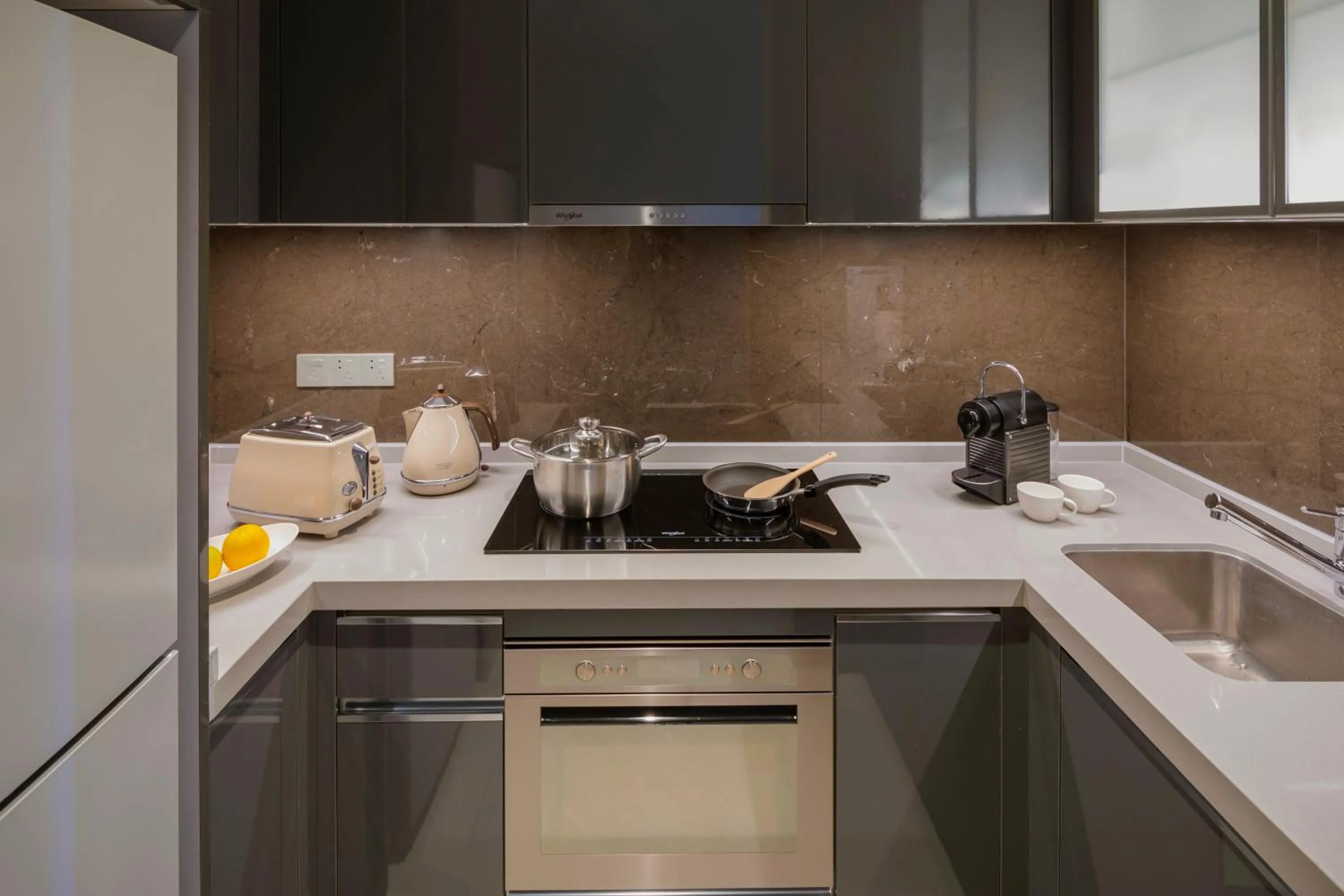 Kitchen or kitchenette in Oakwood Apartments Sanya