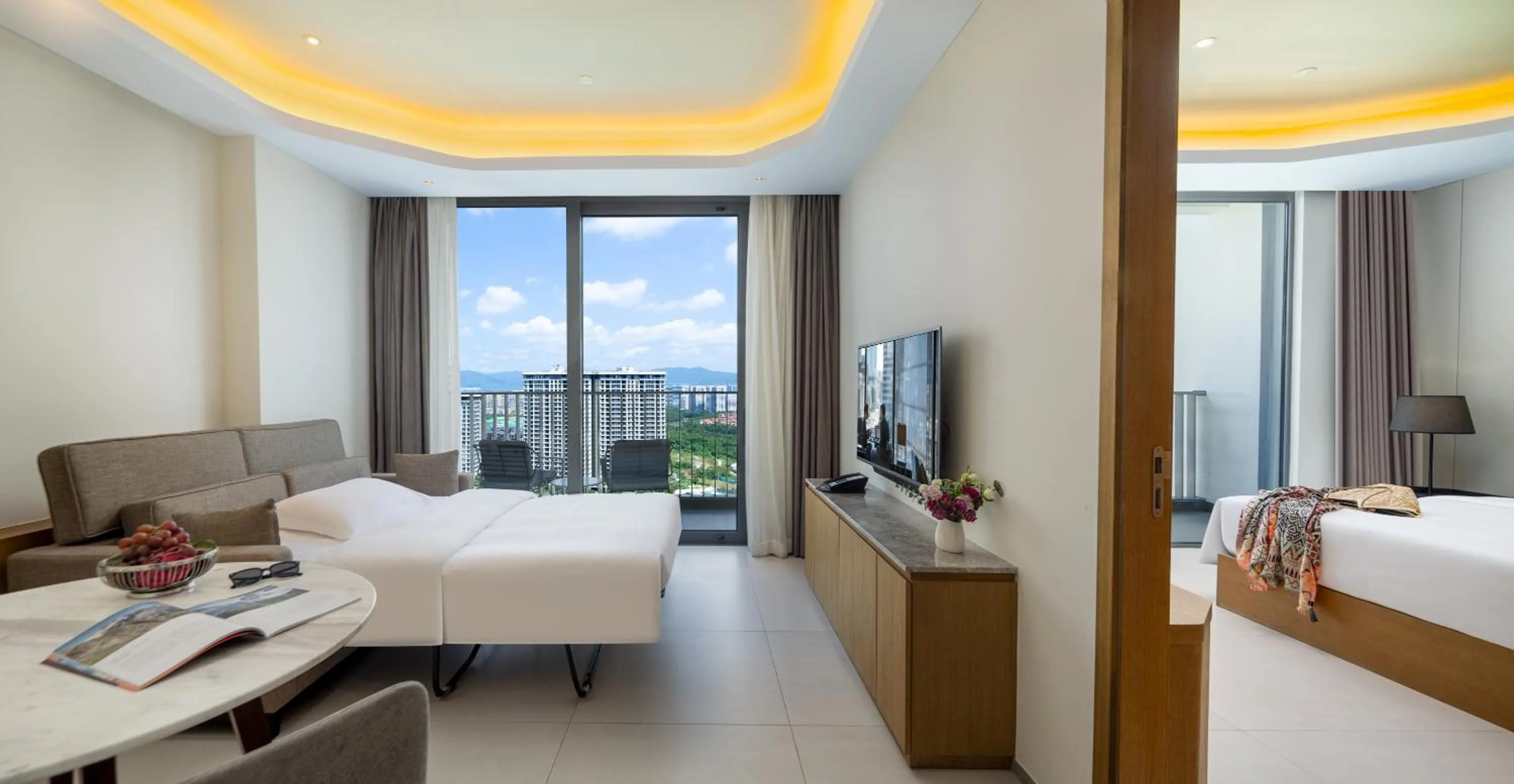 TV and multimedia, Bed in Oakwood Apartments Sanya