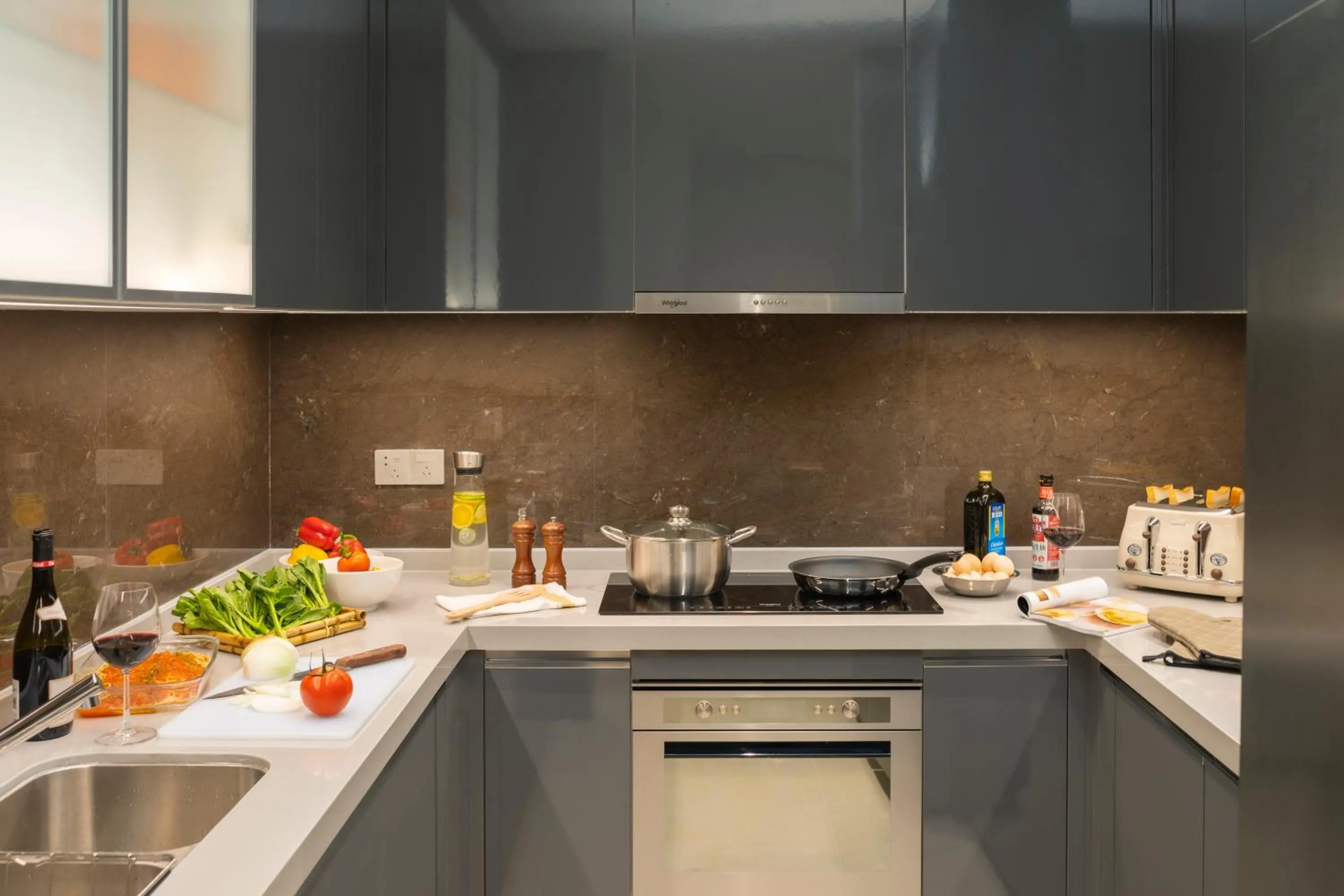 Kitchen or kitchenette in Oakwood Apartments Sanya