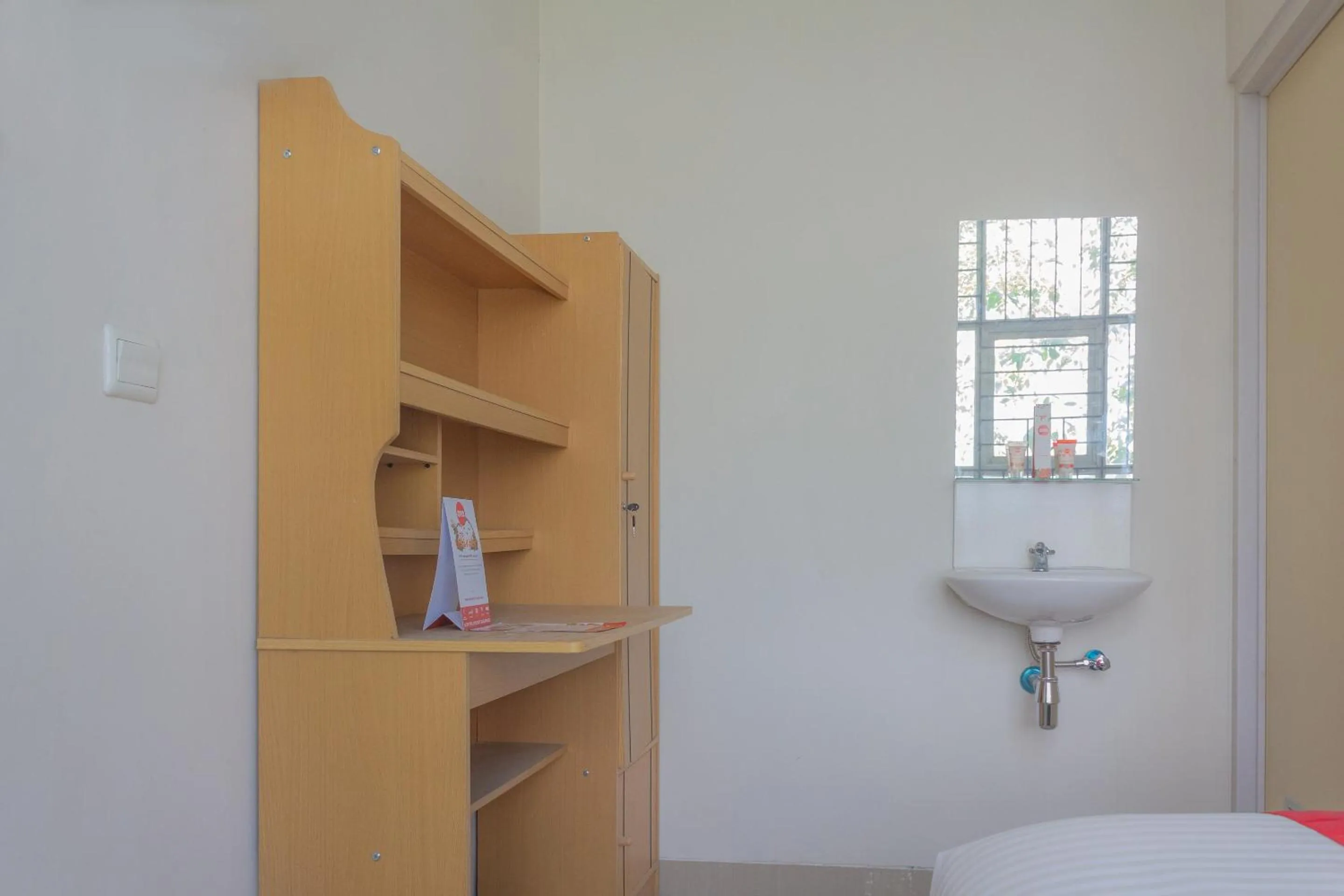 Bedroom in Hotel O 77 Guesthouse