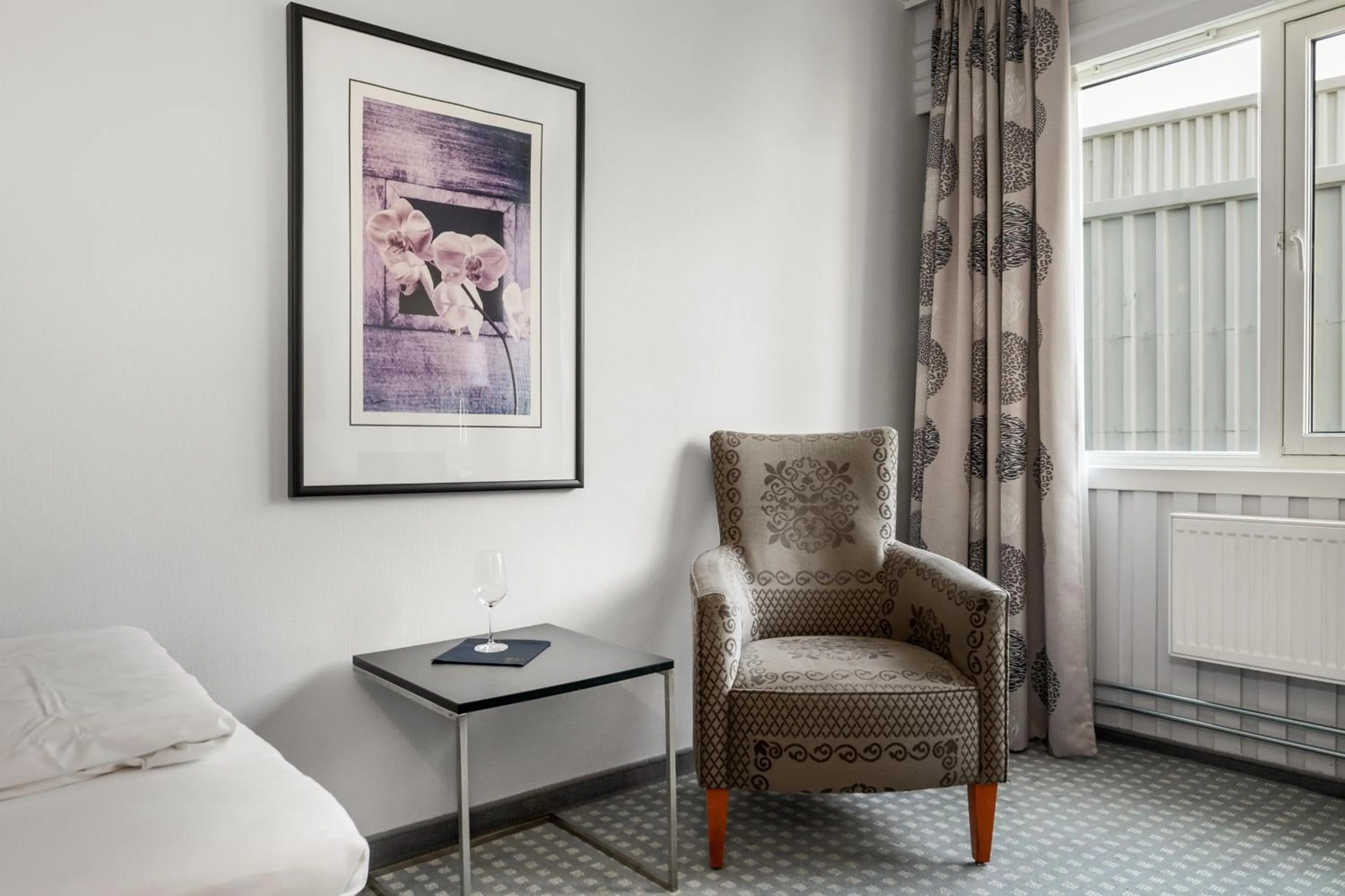 Seating area, Bed in Frichs Hotel Hamar