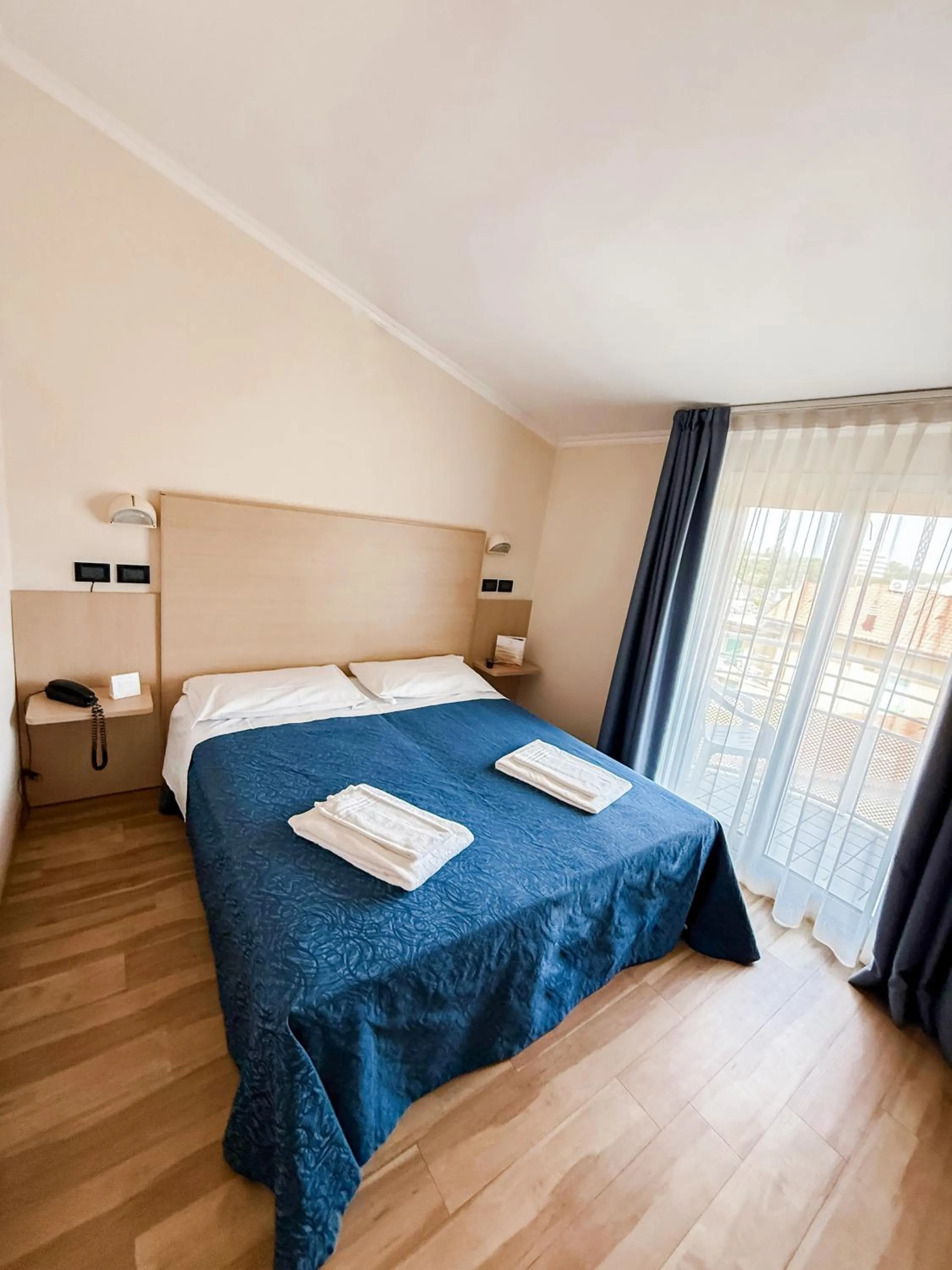 Bed in Hotel Bella Igea