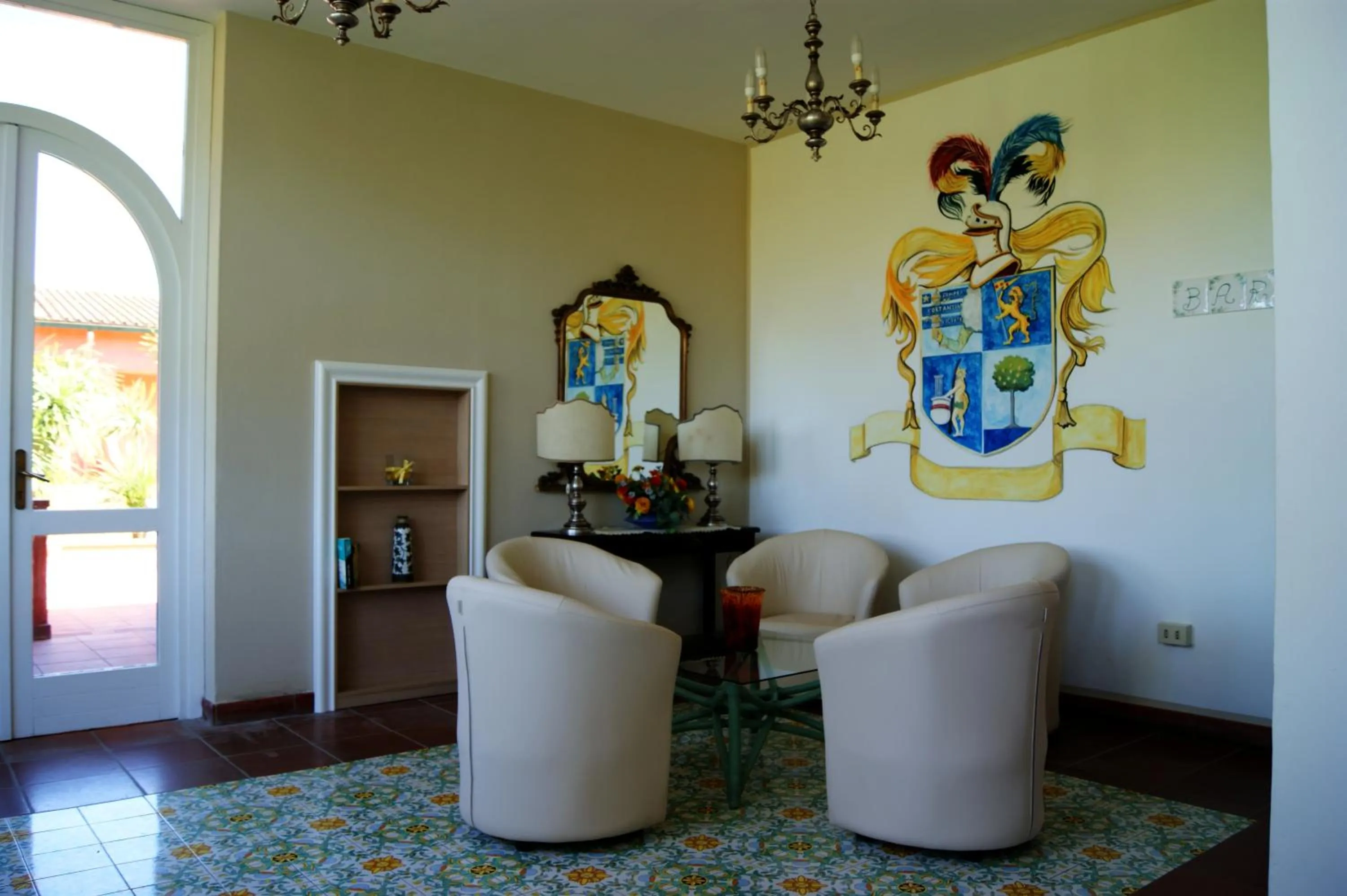 Communal lounge/ TV room in Hotel Residence Villa San Giovanni