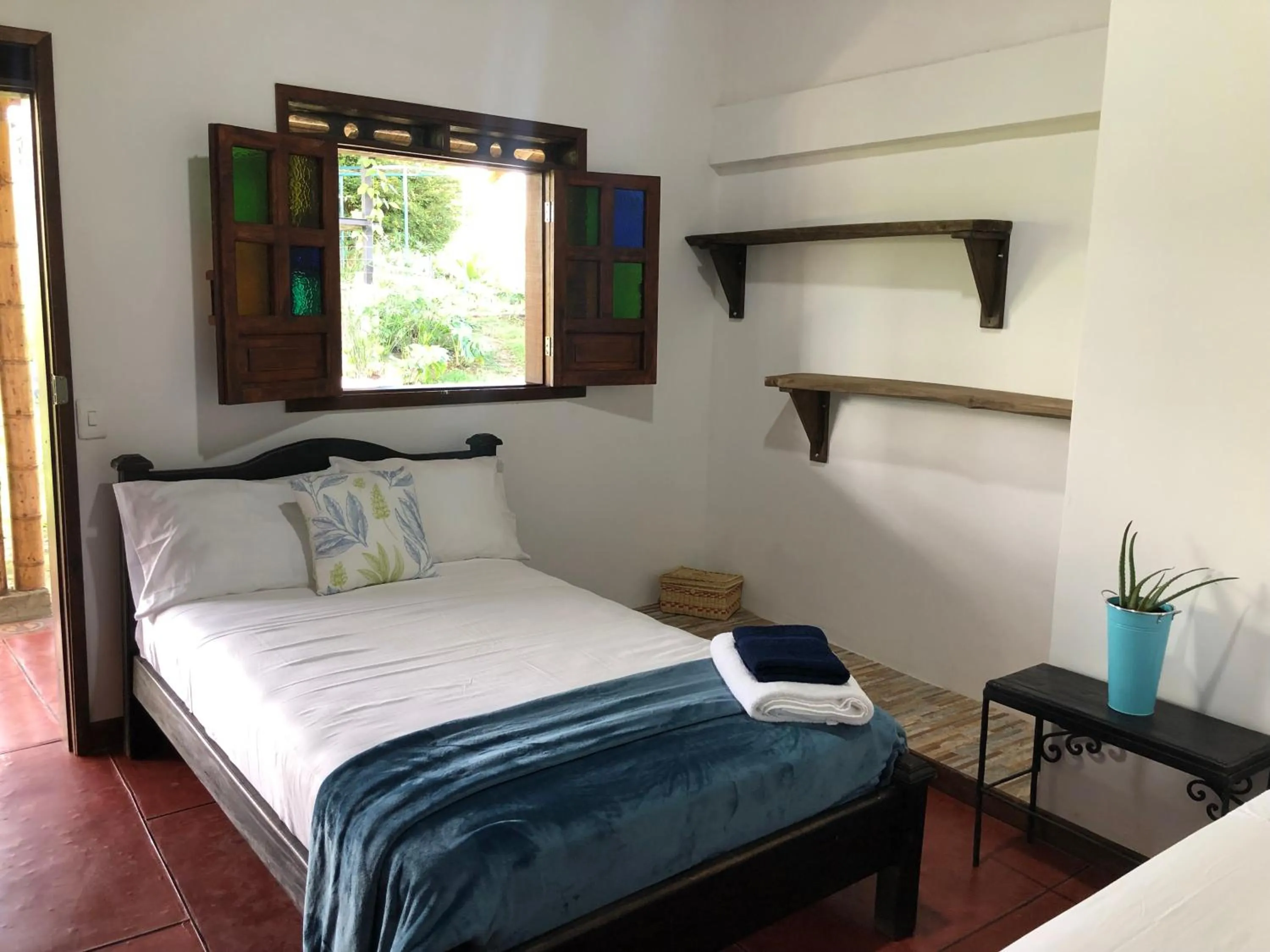 Bed in Finca Hotel Brasilia