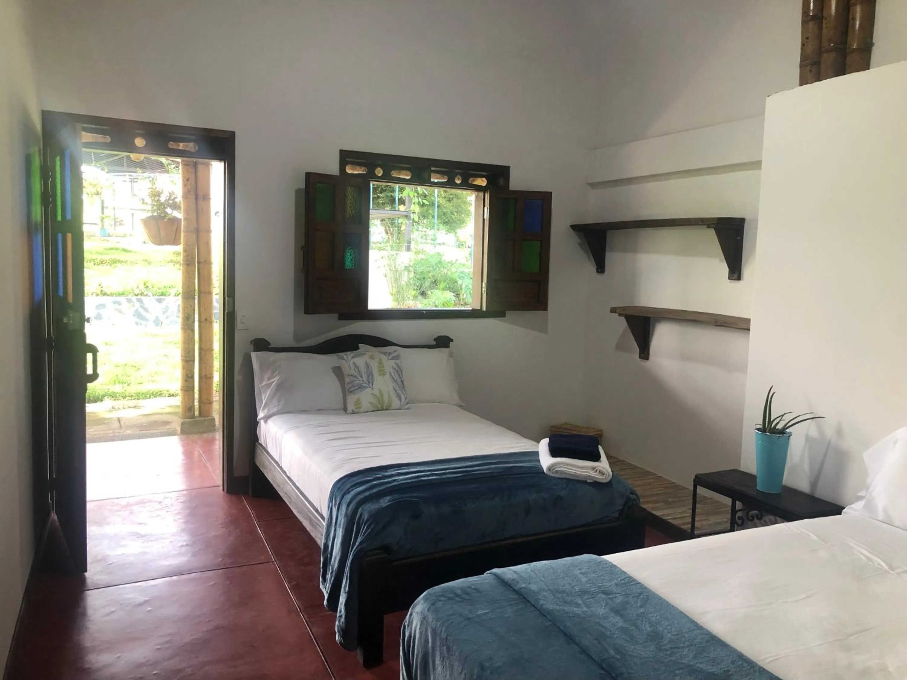 Bed in Finca Hotel Brasilia