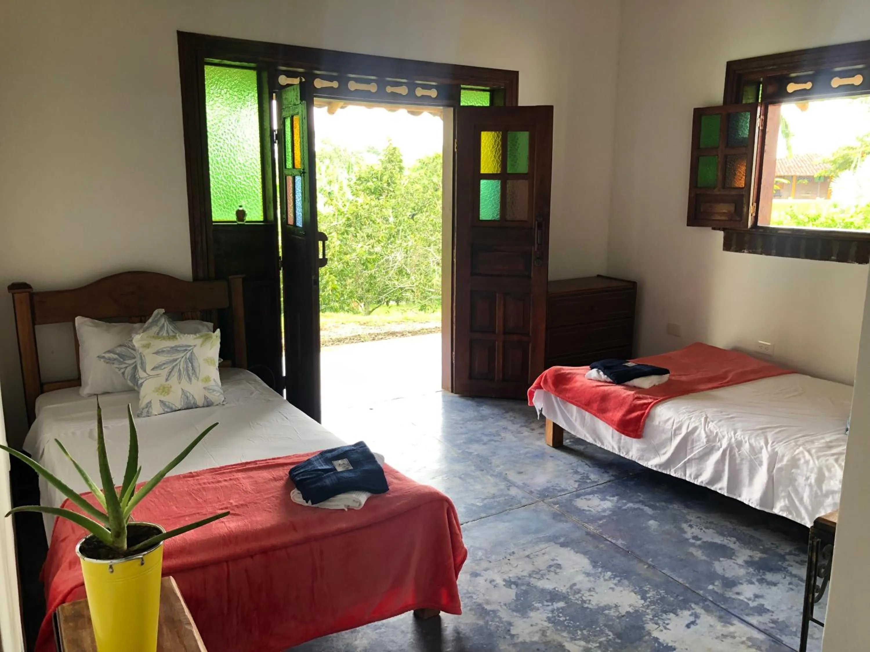 Bed in Finca Hotel Brasilia