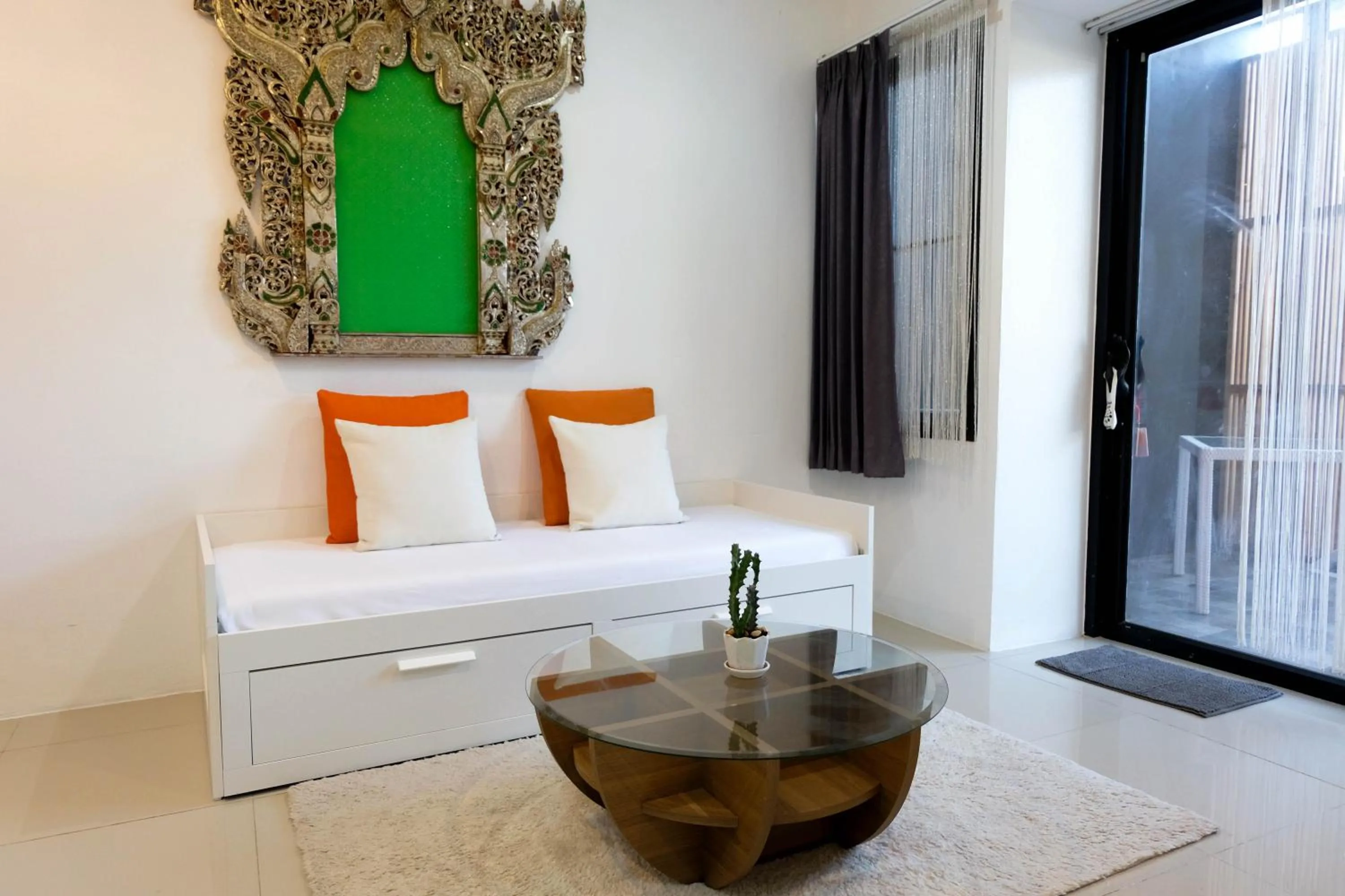 Seating area, Bed in Baan Poon Garden