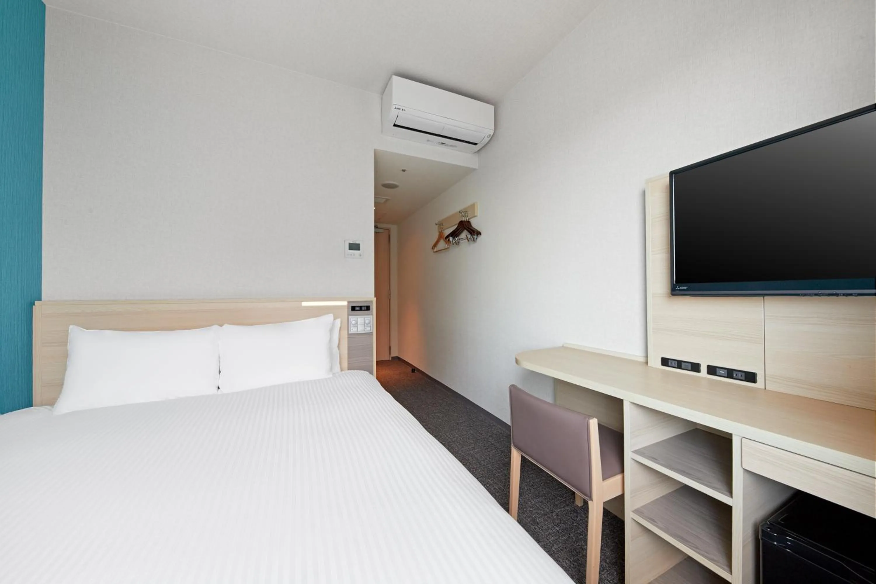 Bed in Sotetsu Fresa Inn Osaka Namba