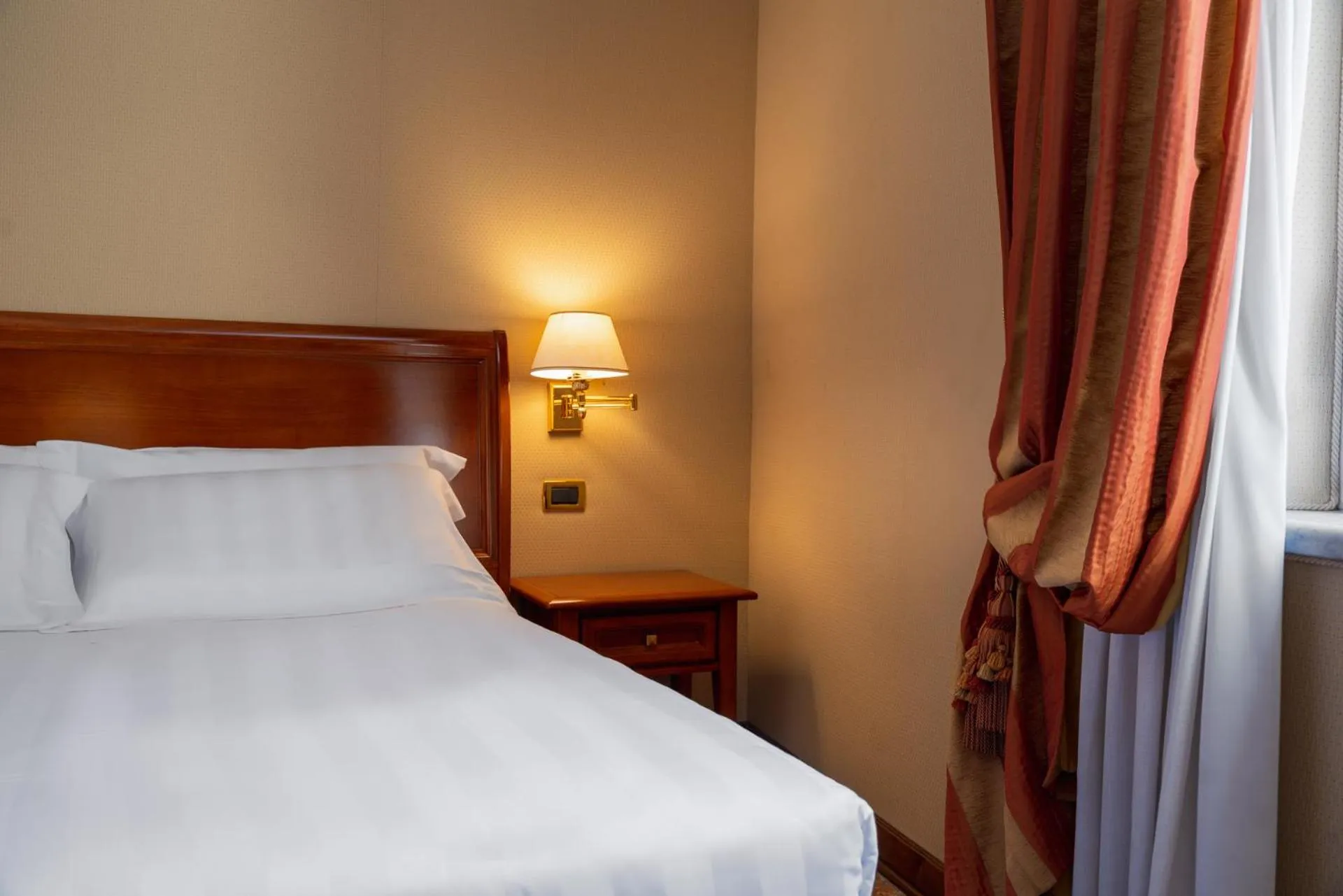 Bed in Hotel Oceania