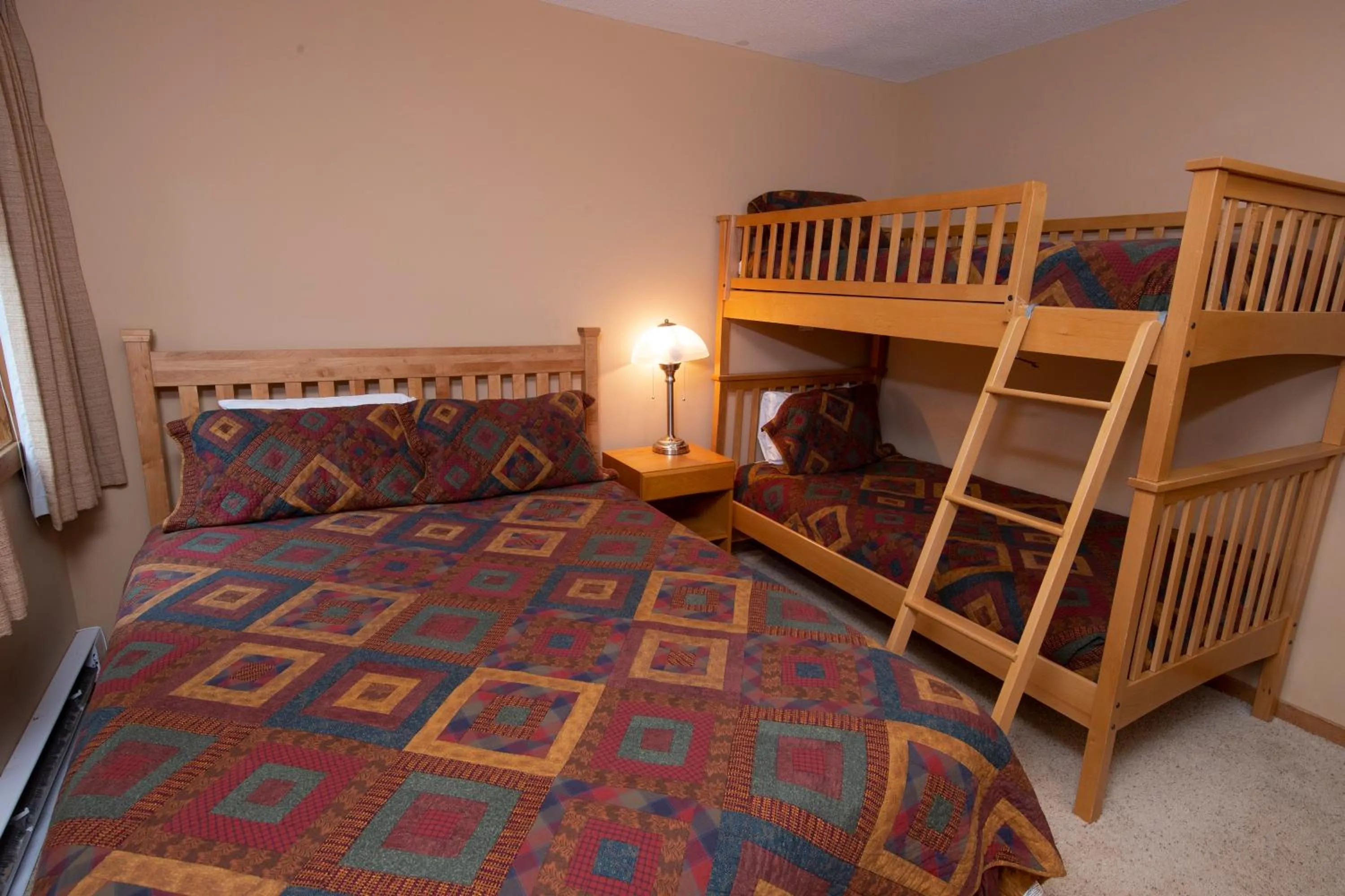 Bed in Okemo Mountain Lodging by Vail Resorts