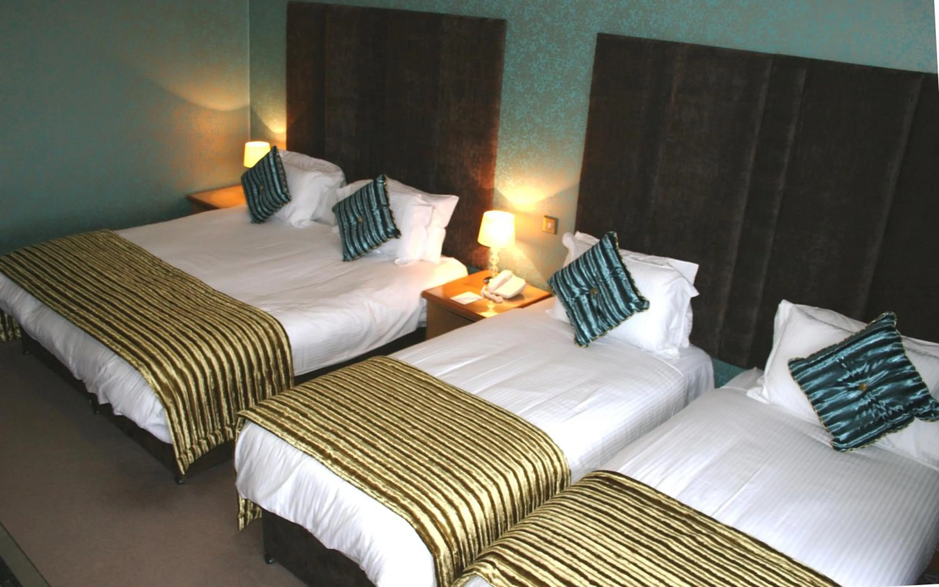 Bed in Royal Court Hotel