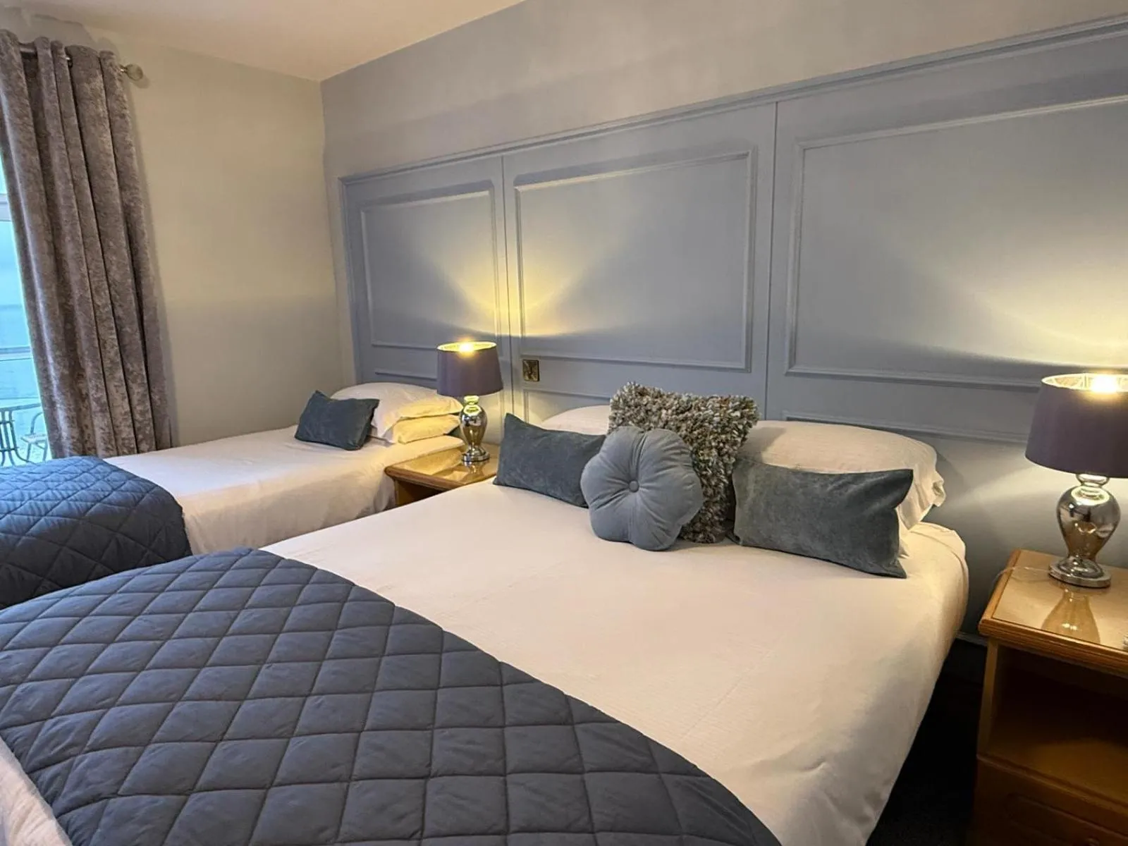 Bed in Royal Court Hotel