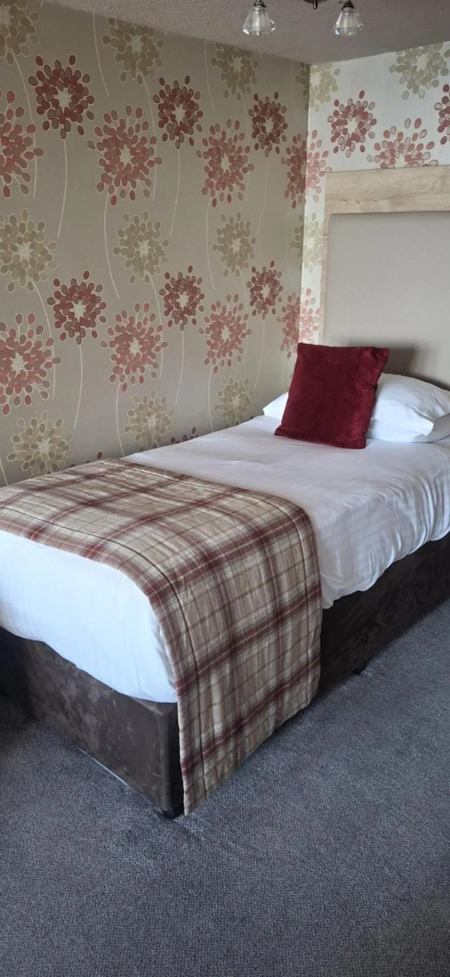 Bed in Royal Court Hotel