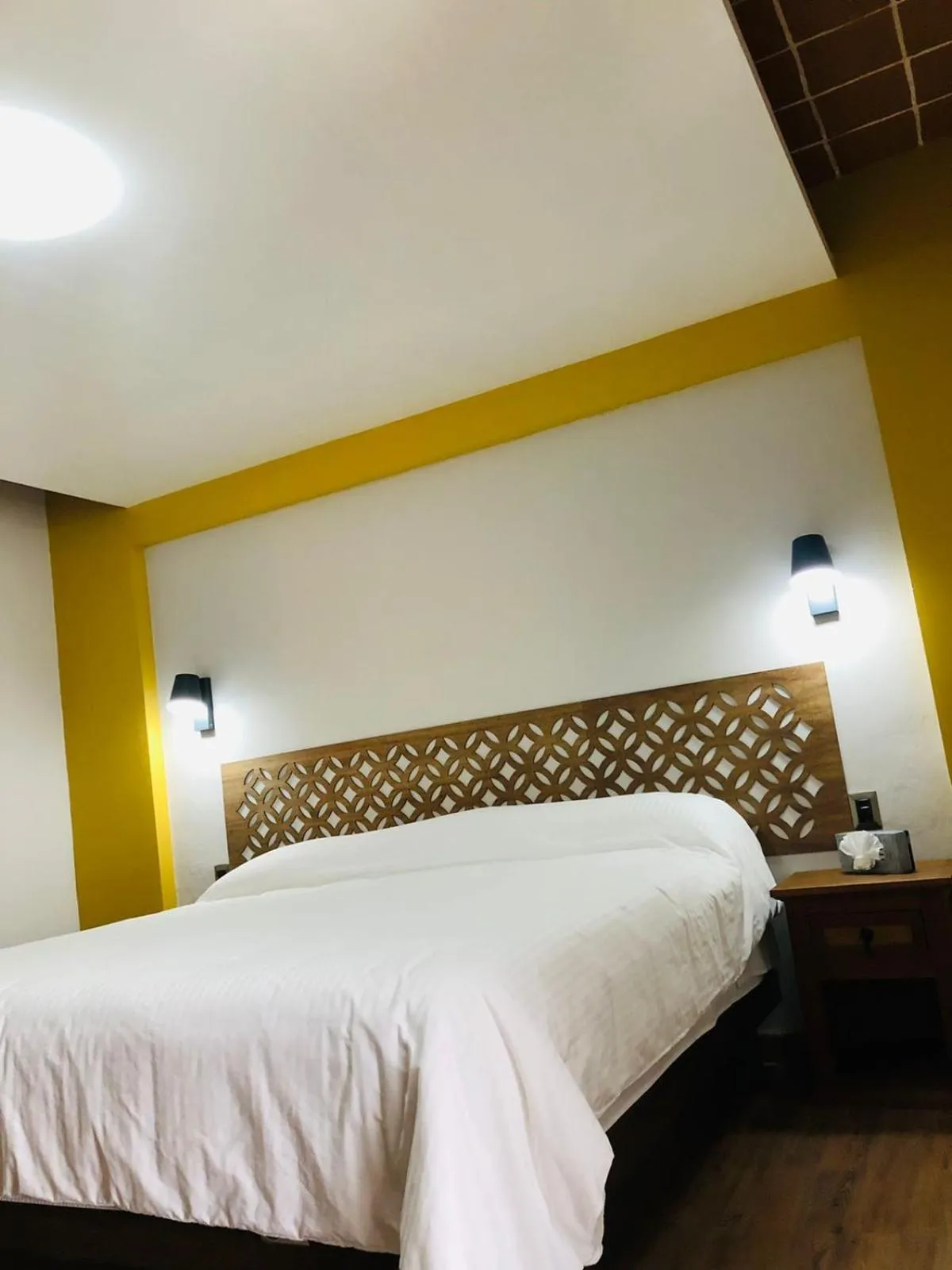 Bed in Hotel La Mansión