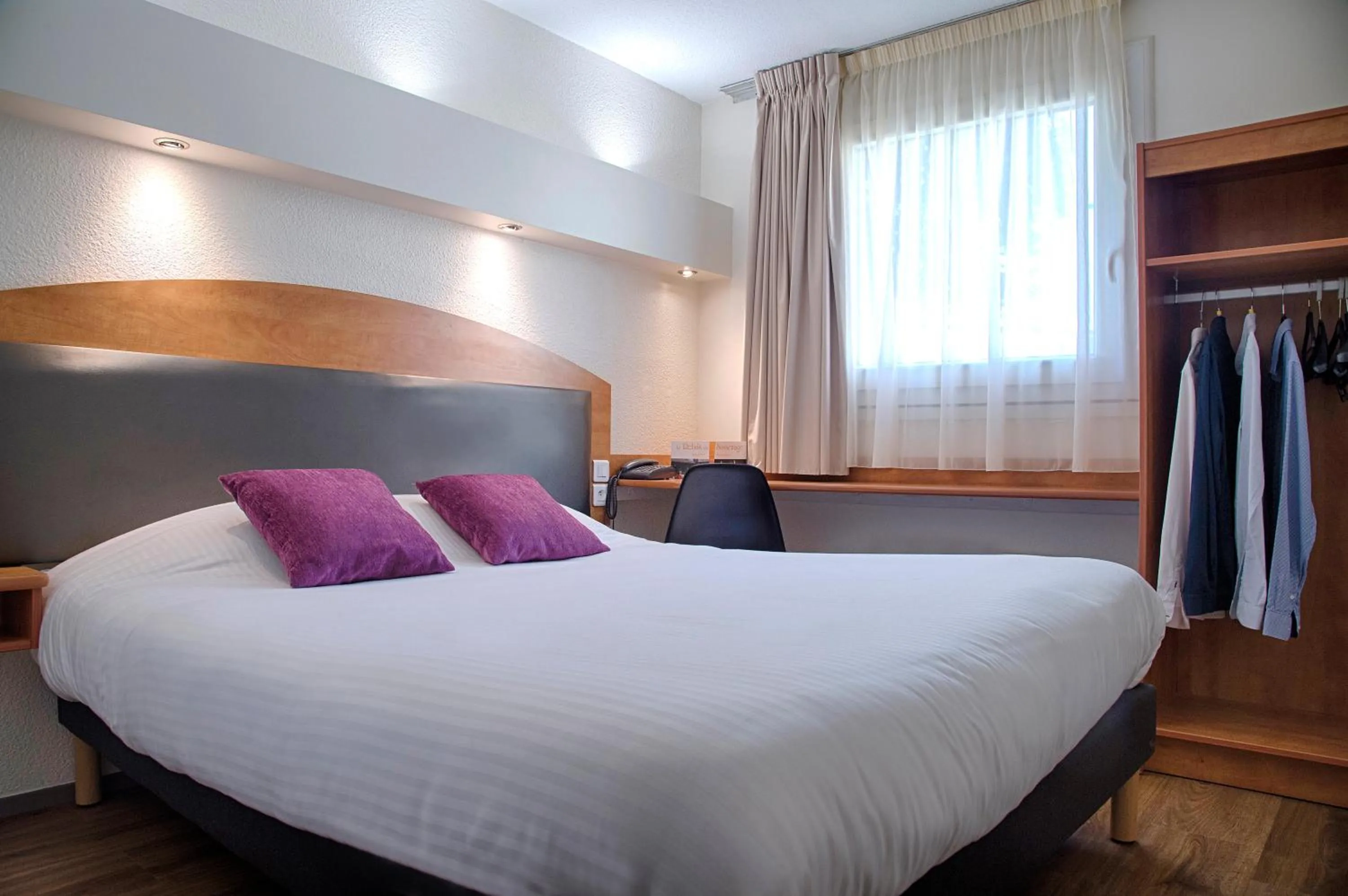 Bed in Logis Le Relais de Sassenage