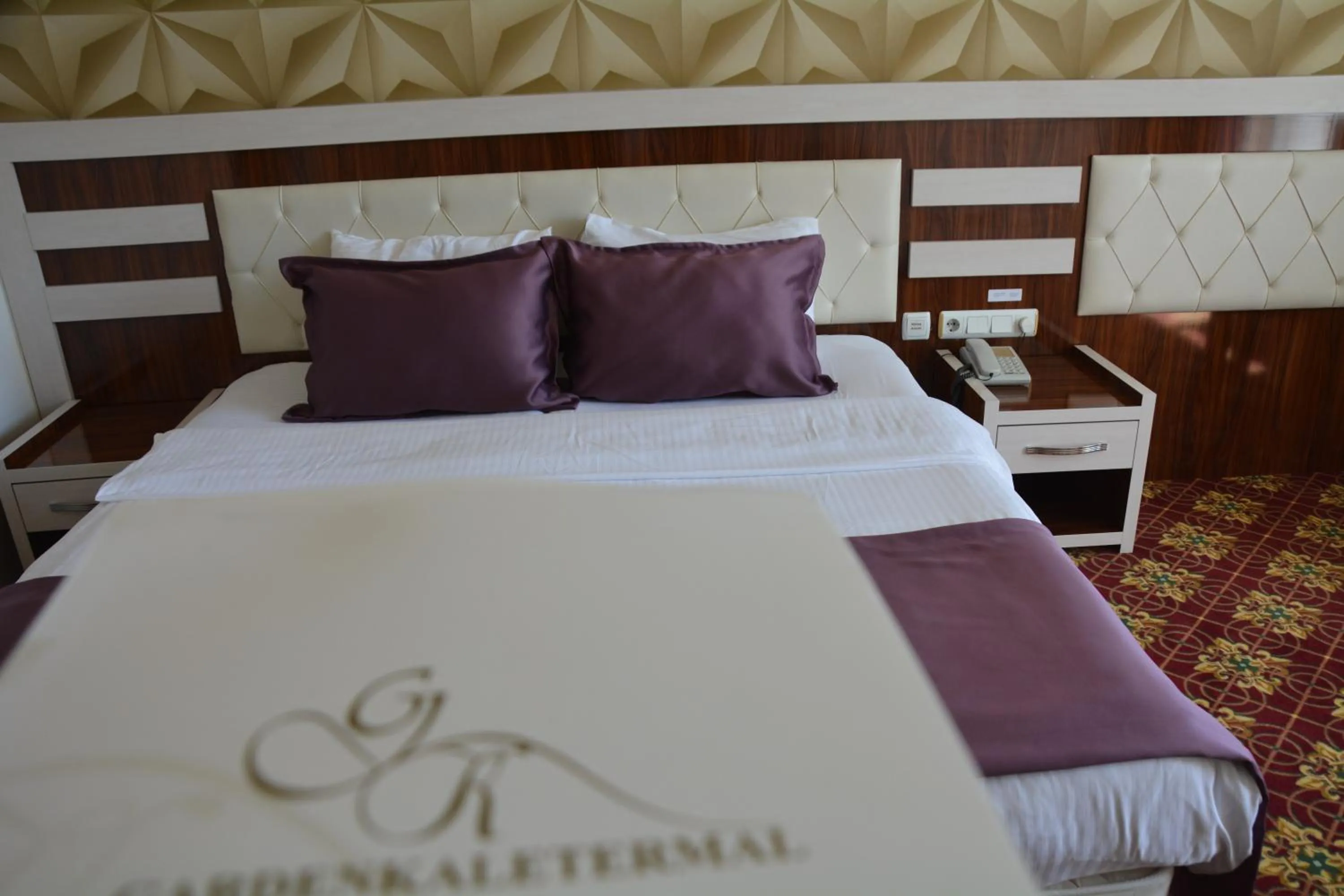 Bed in GARDEN KALE THERMAL HOTEL