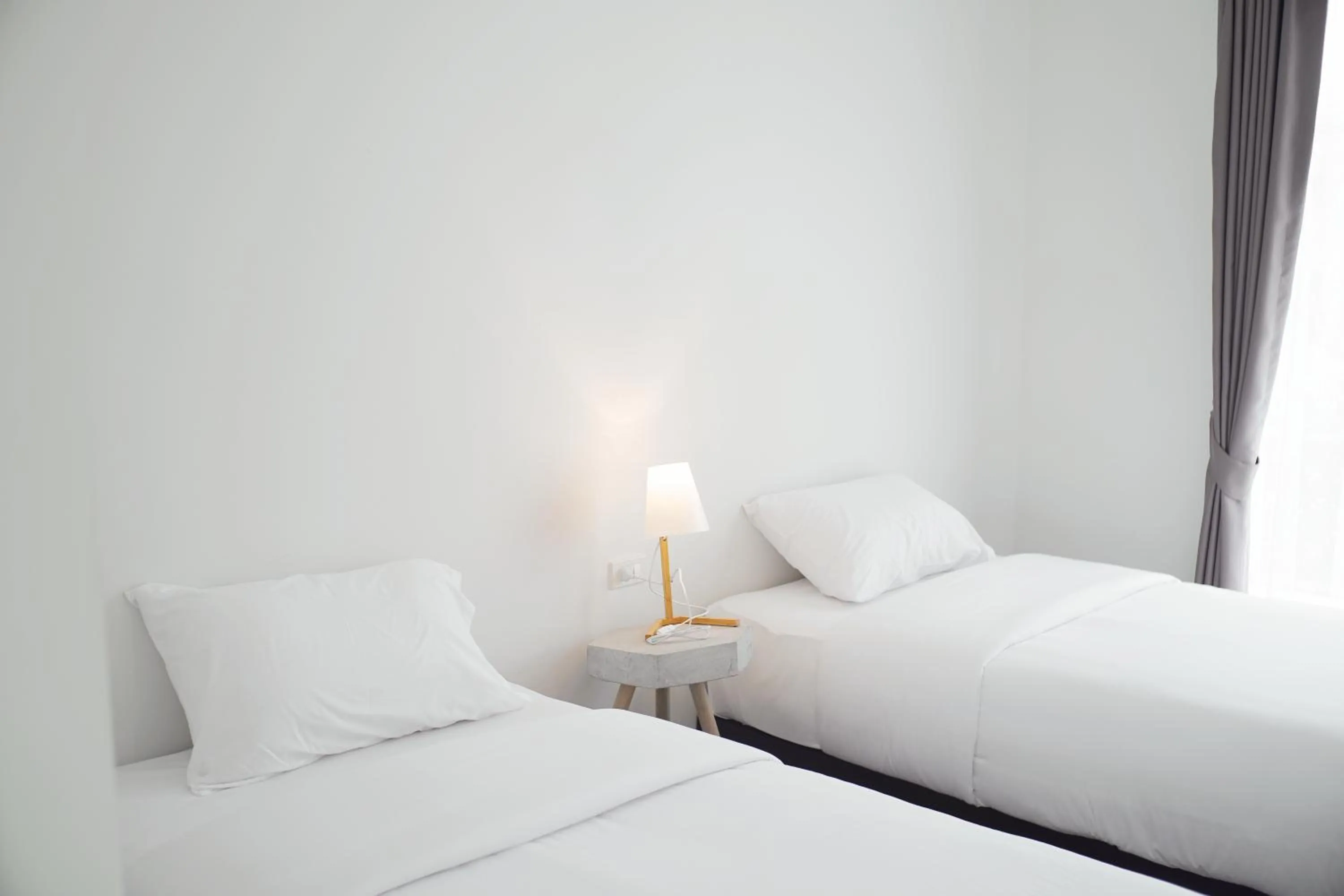 Bed in MEET Boutique Resort