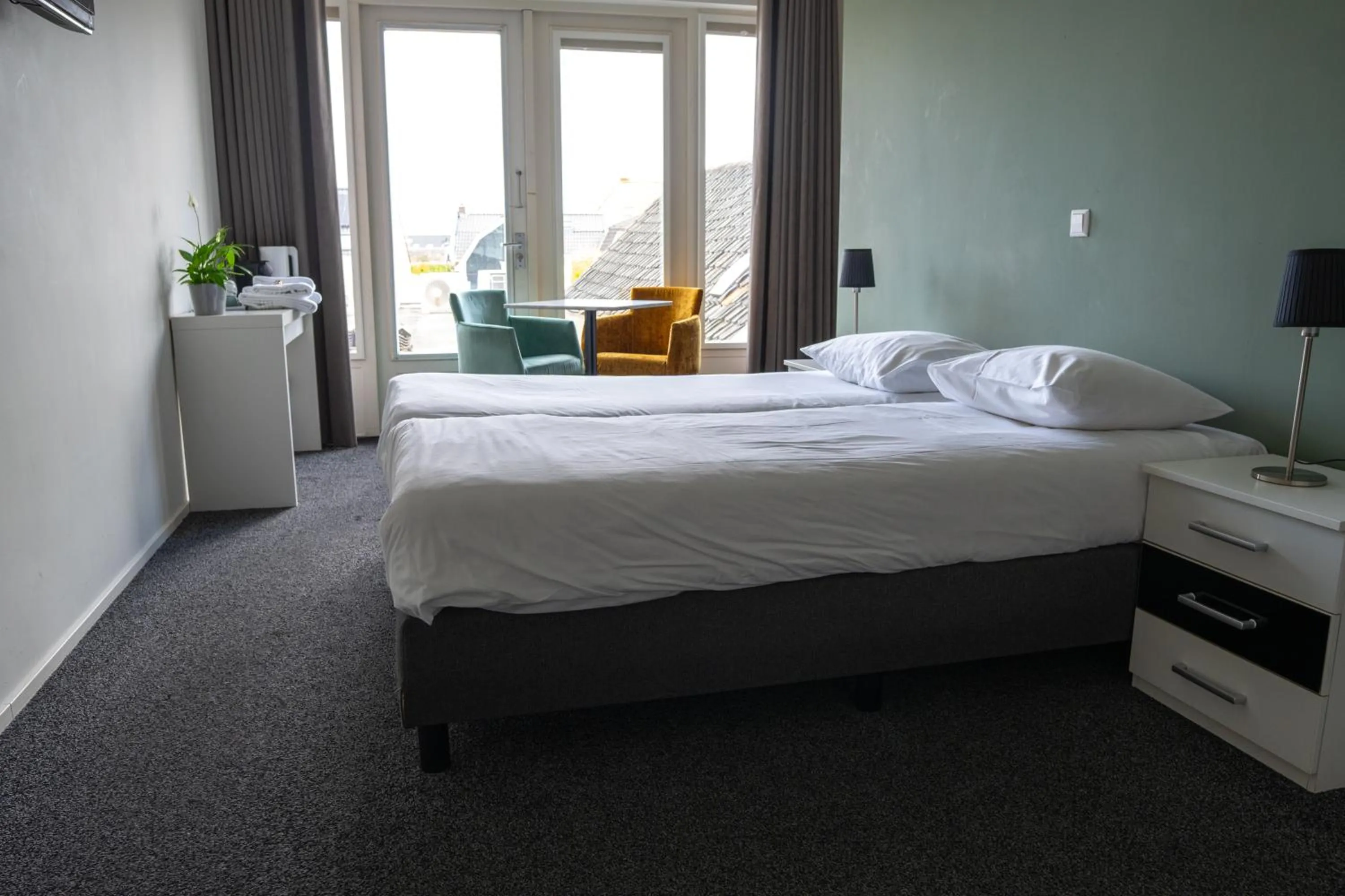 Bed in OTTO Boutique Hotel