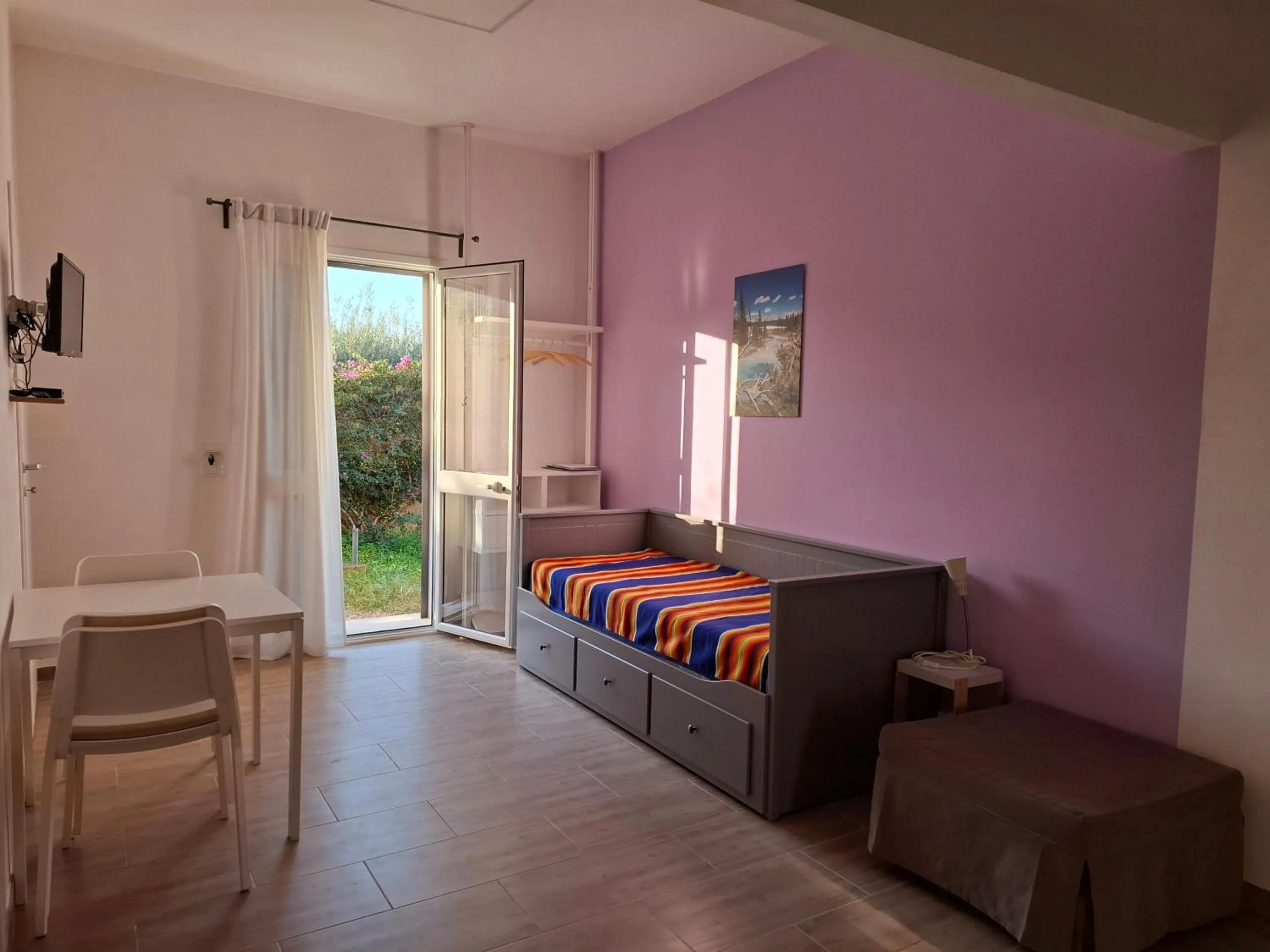 Bed in Turtle Island Apartments