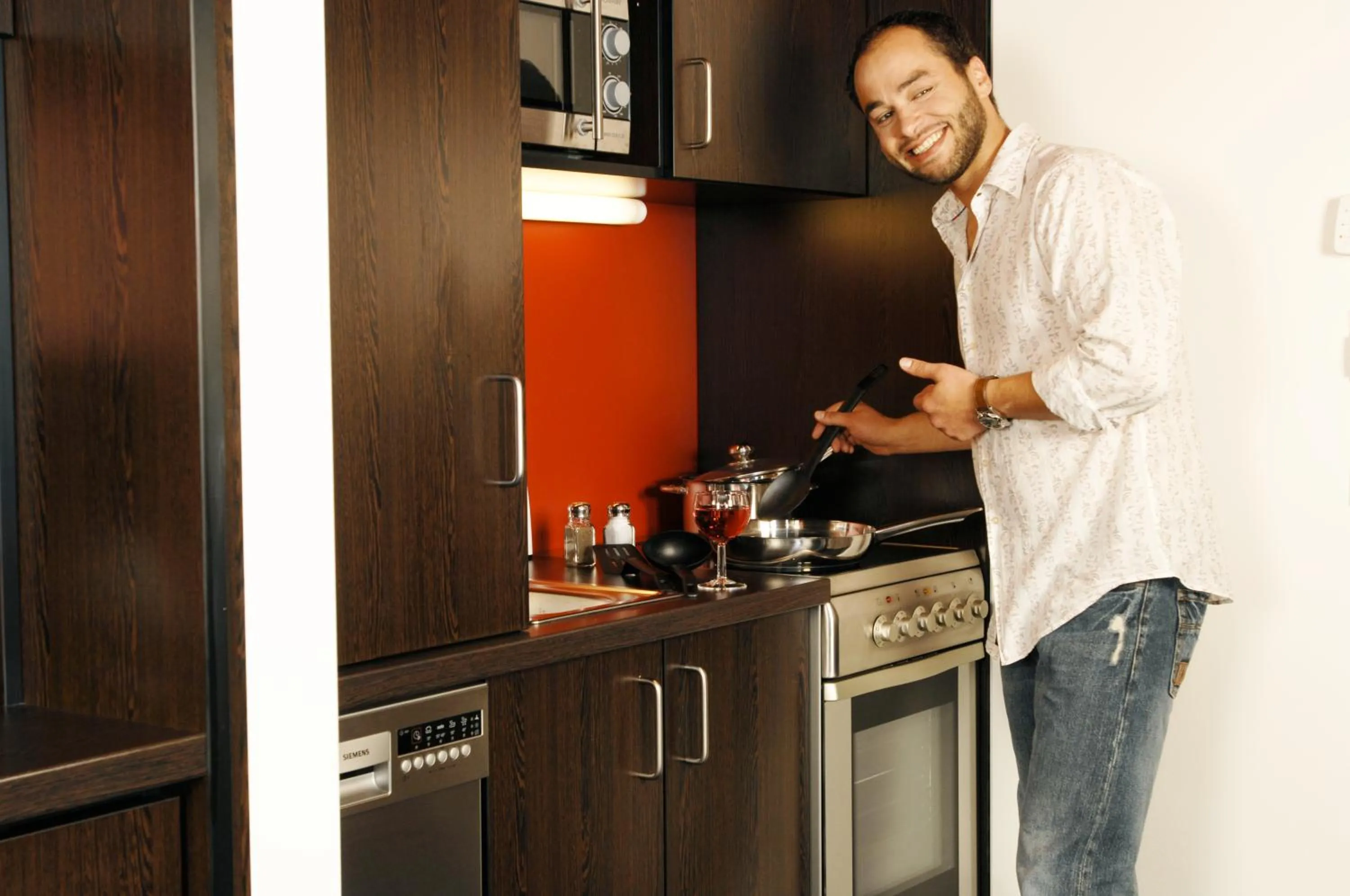 Kitchen or kitchenette in Stay2Munich Hotel & Serviced Apartments