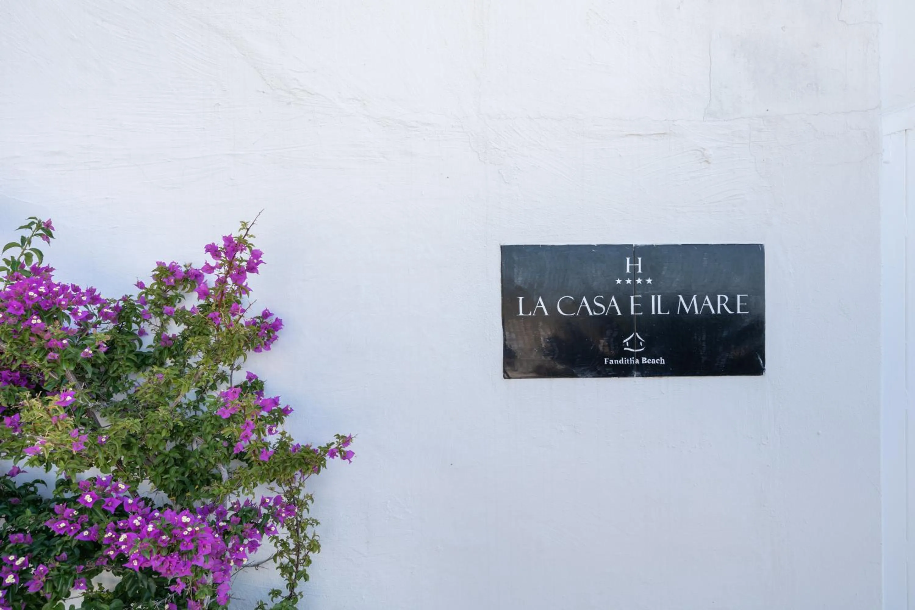 Property logo or sign in La Casa E Il Mare, Private Bay Hotel