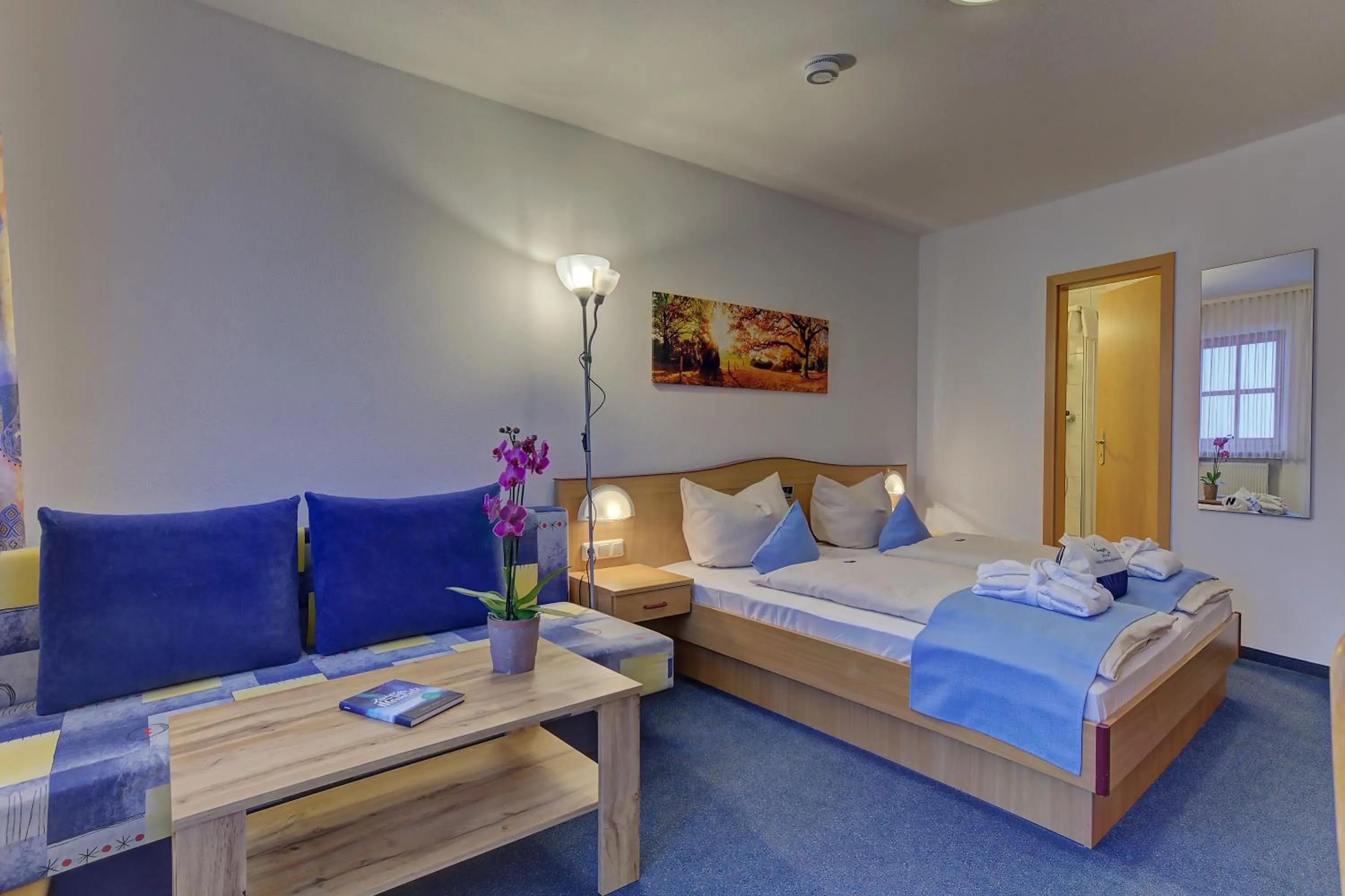 Living room, Bed in Landhotel Tannenhof