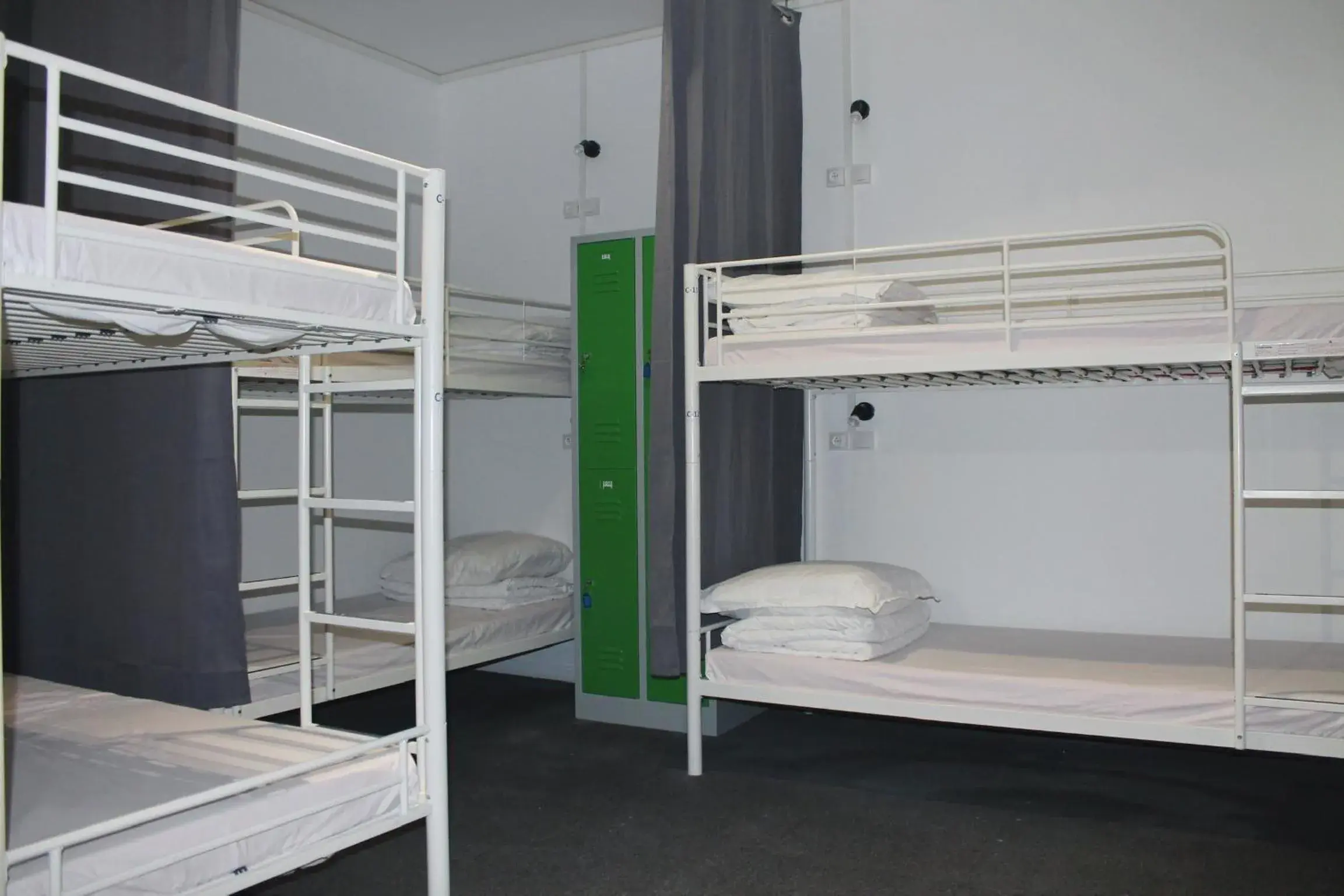 Bunk Bed in Mixed Dormitory Room with Shared Bathroom in Le Coffice Auberge de Jeunesse Bunk Bed in Mixed Dormitory Room with Shared Bathroom in Le Coffice Auberge de Jeunesse