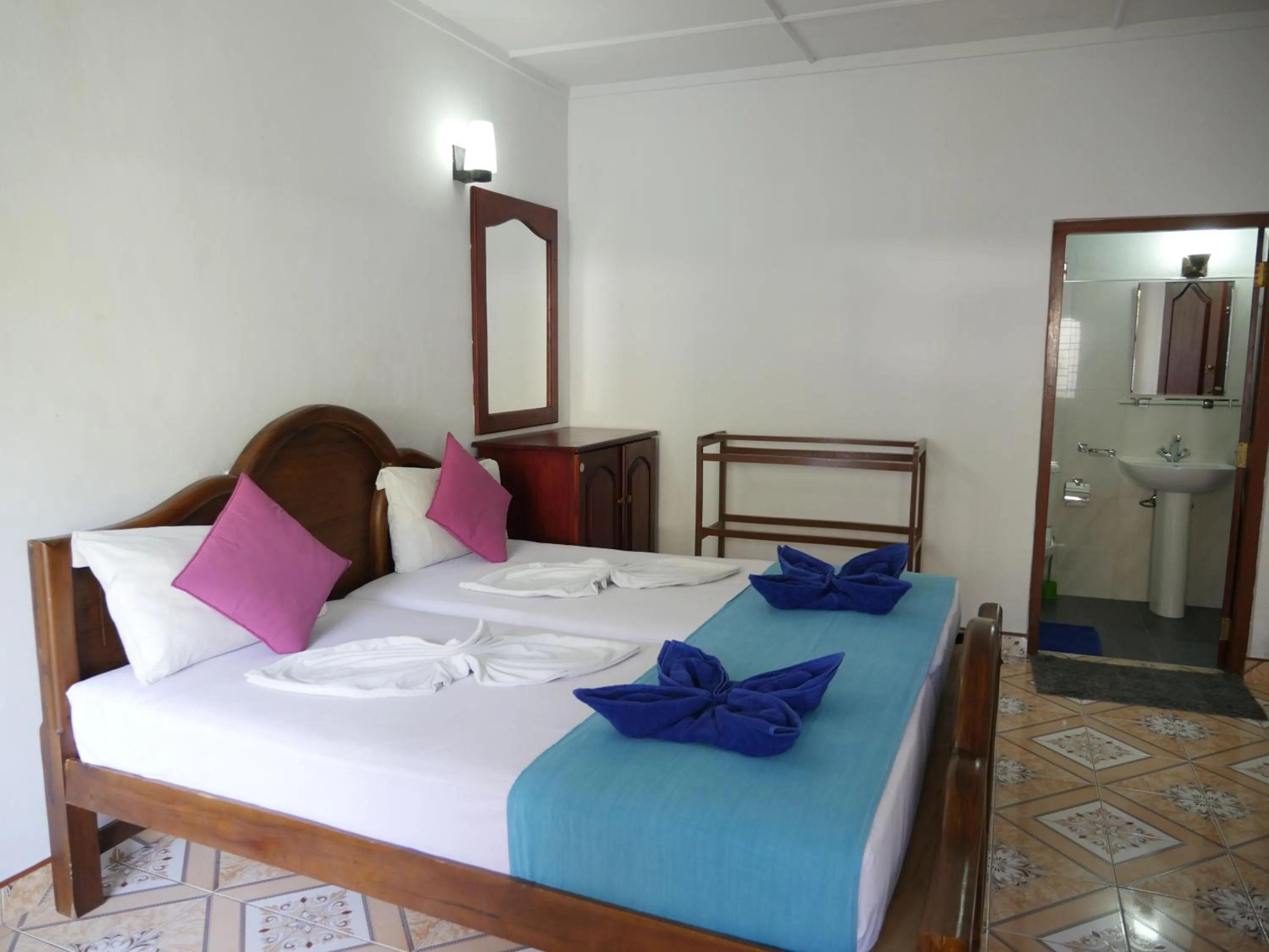 Bed in Ocean View tourist guest house at Negombo beach near the airport