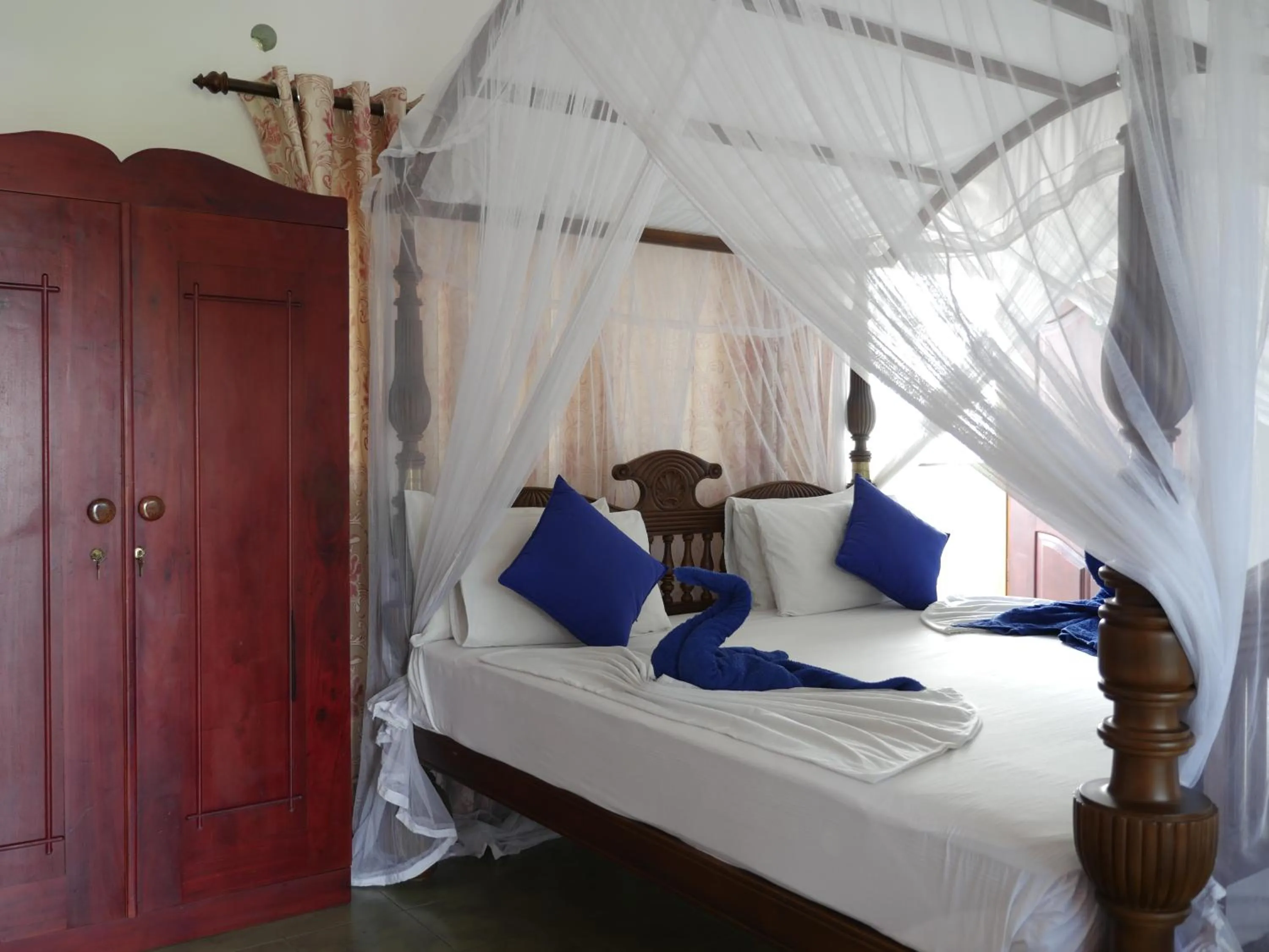 Bed in Ocean View tourist guest house at Negombo beach near the airport