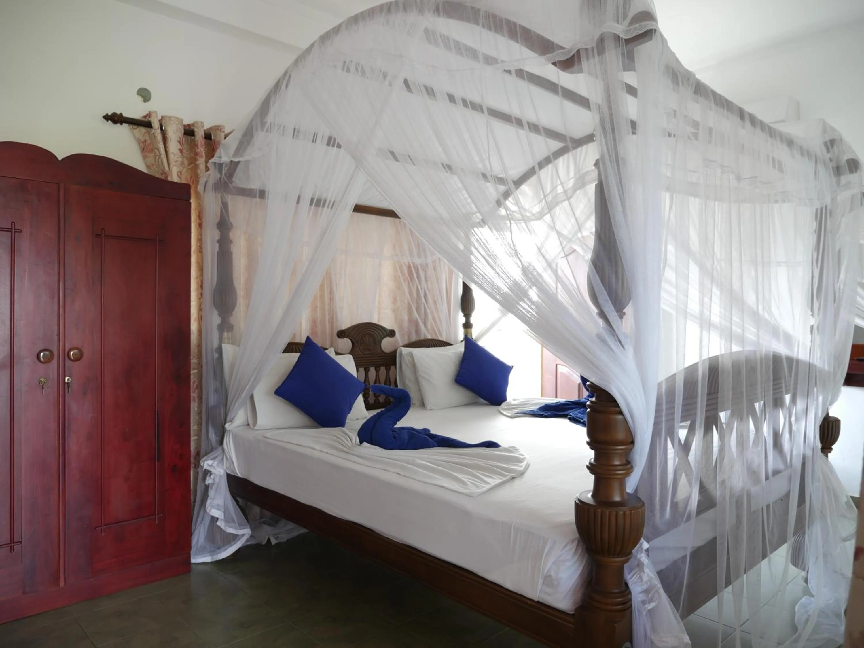 Bed in Ocean View tourist guest house at Negombo beach near the airport
